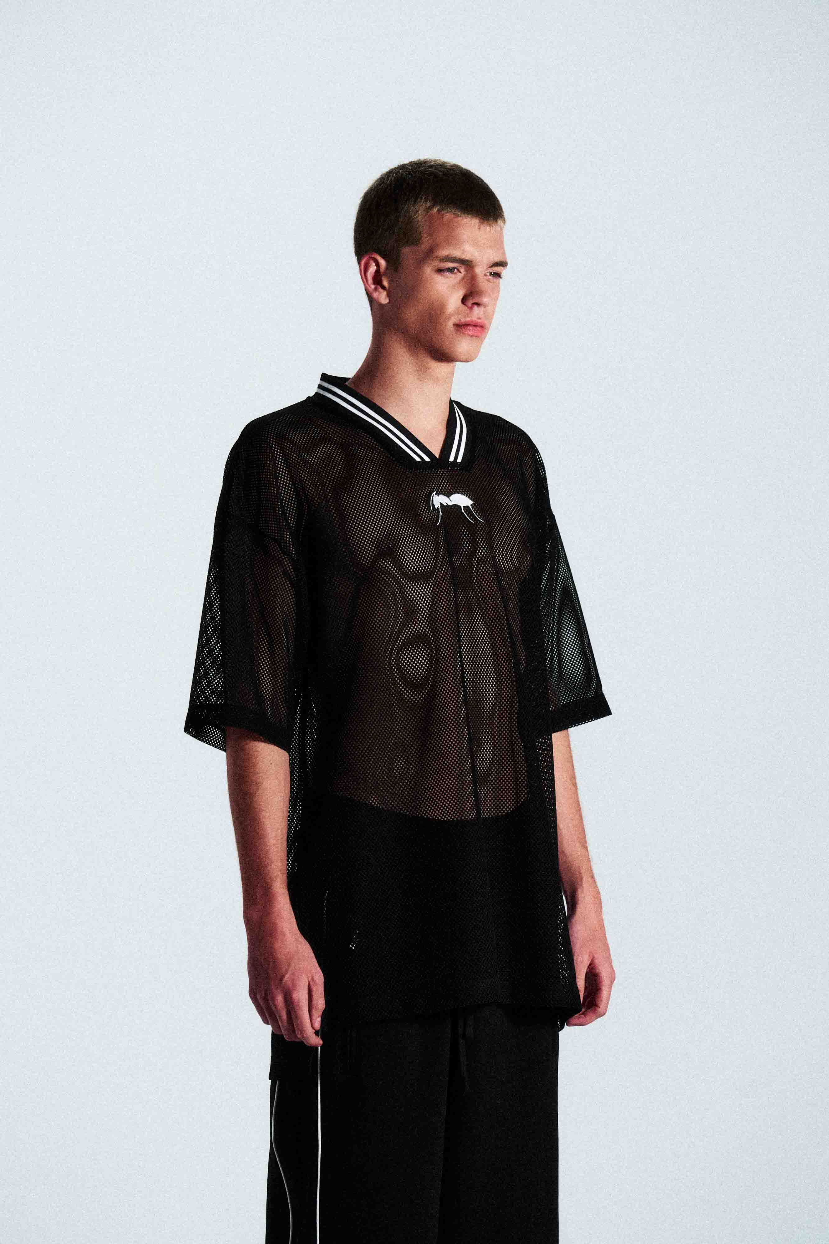 Short-sleeve sports jersey made of 100% polyester mesh. Lightweight, breathable, and quick-drying. White ANTS logos on front and back. Straight cut with comfortable fit.