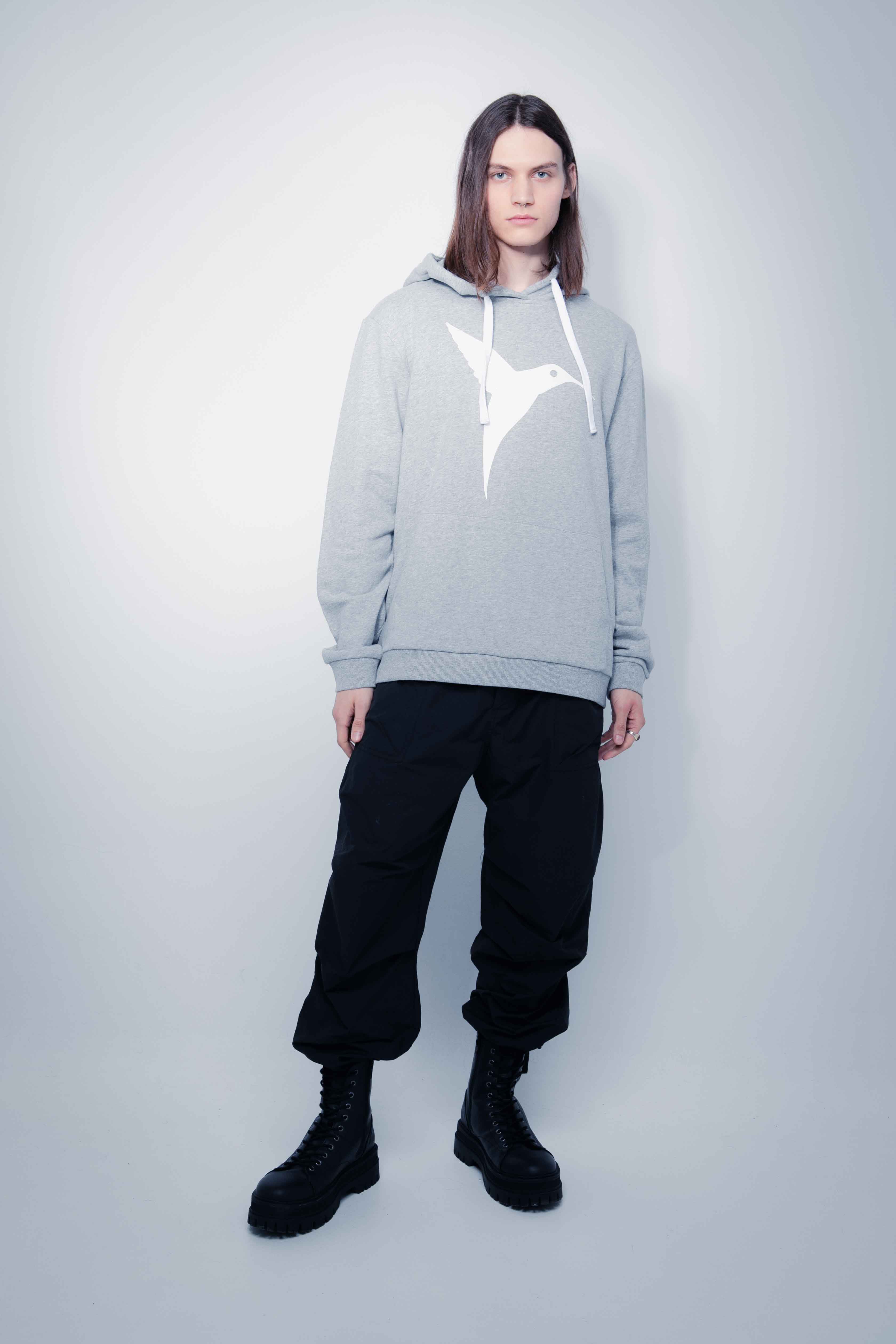 Adjustable hoodie with drawstring and long sleeves. Contrasting combined print detail on the front and back. Kangaroo pocket on the front. Rib finishes.