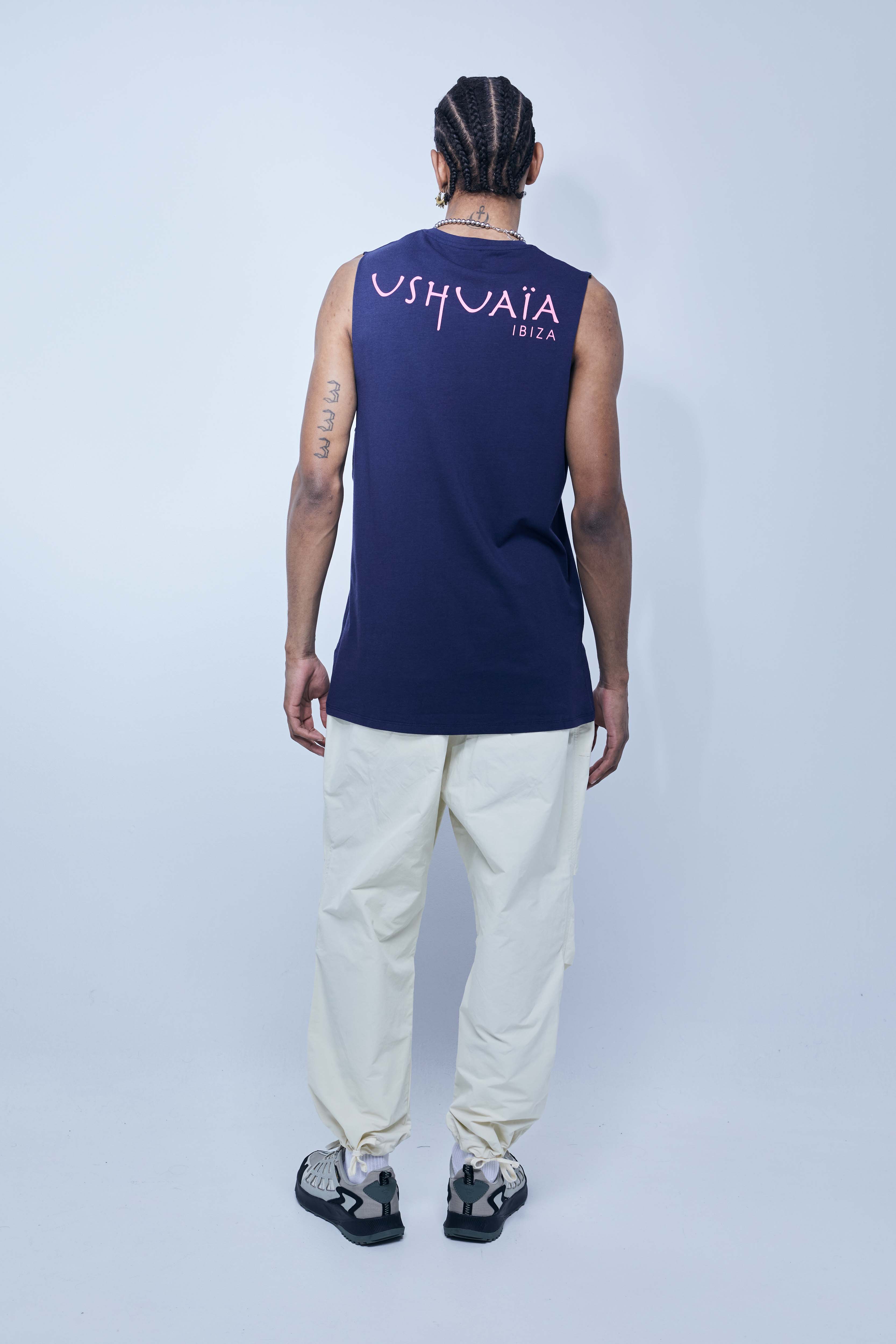 Round neck T-shirt with washed armhole sleeves with a fade out effect. Contrasting combined print detail on the front and back.