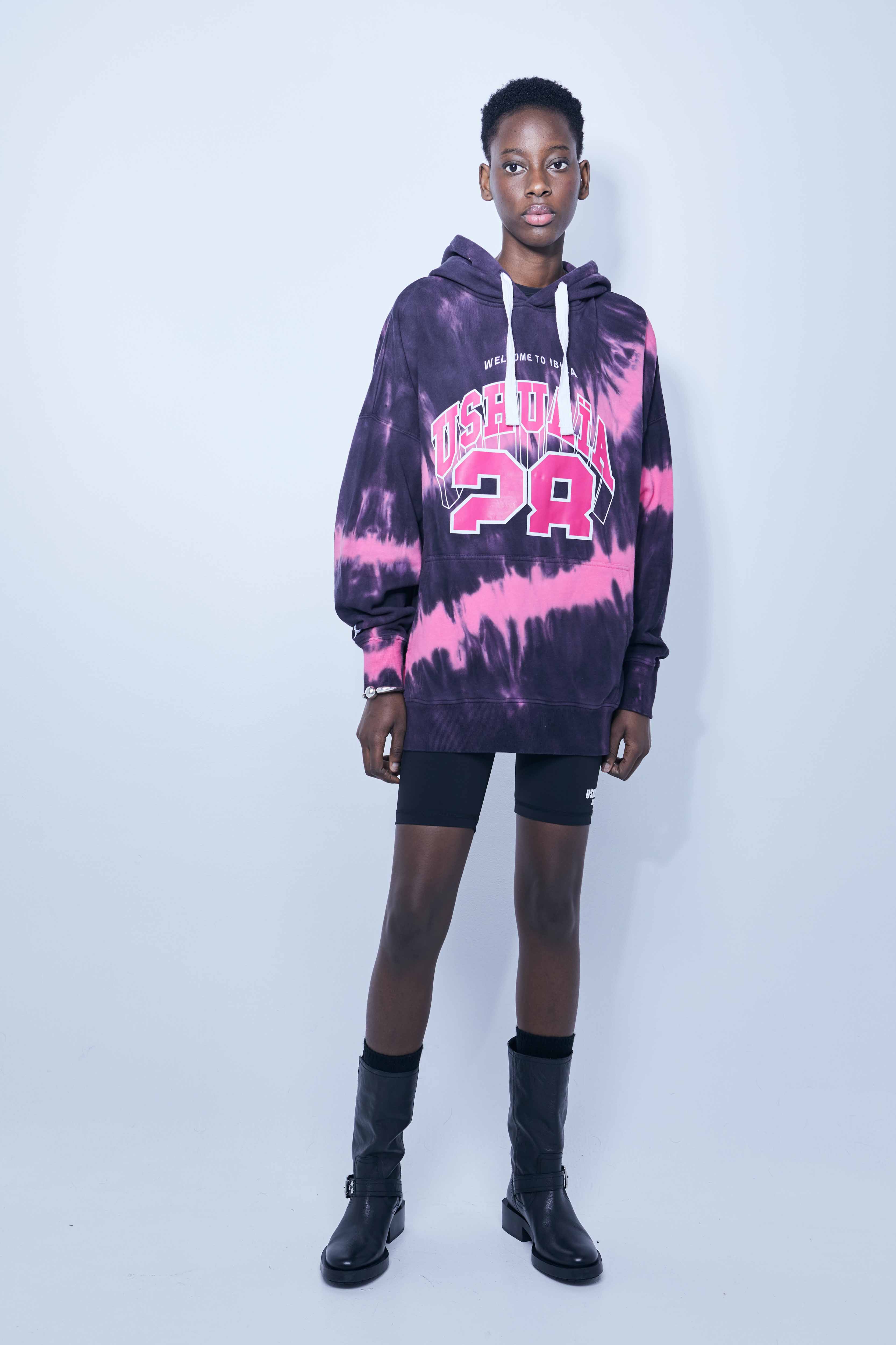 Washed long-sleeved hooded sweatshirt with tie-dye effect. Contrast combined print and embroidery detail on the front. Kangaroo pocket. Rib finishes.