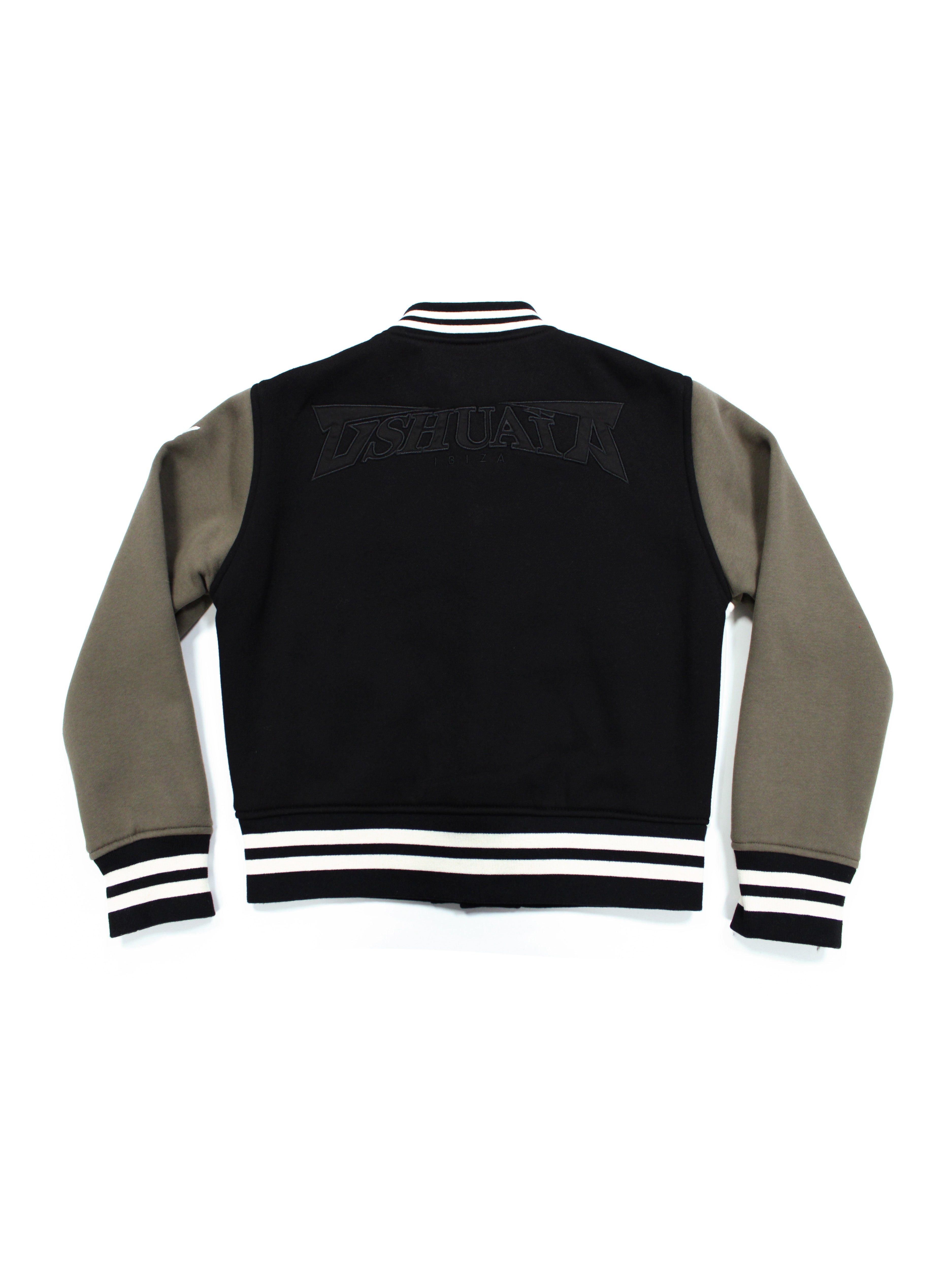 Varsity jacket made of plush fabric. Double welt pockets on the front and interior pocket detail. Application of patches and contrasting combined embroidery on the front and back. Rib finishes. Front closure with snap buttons.