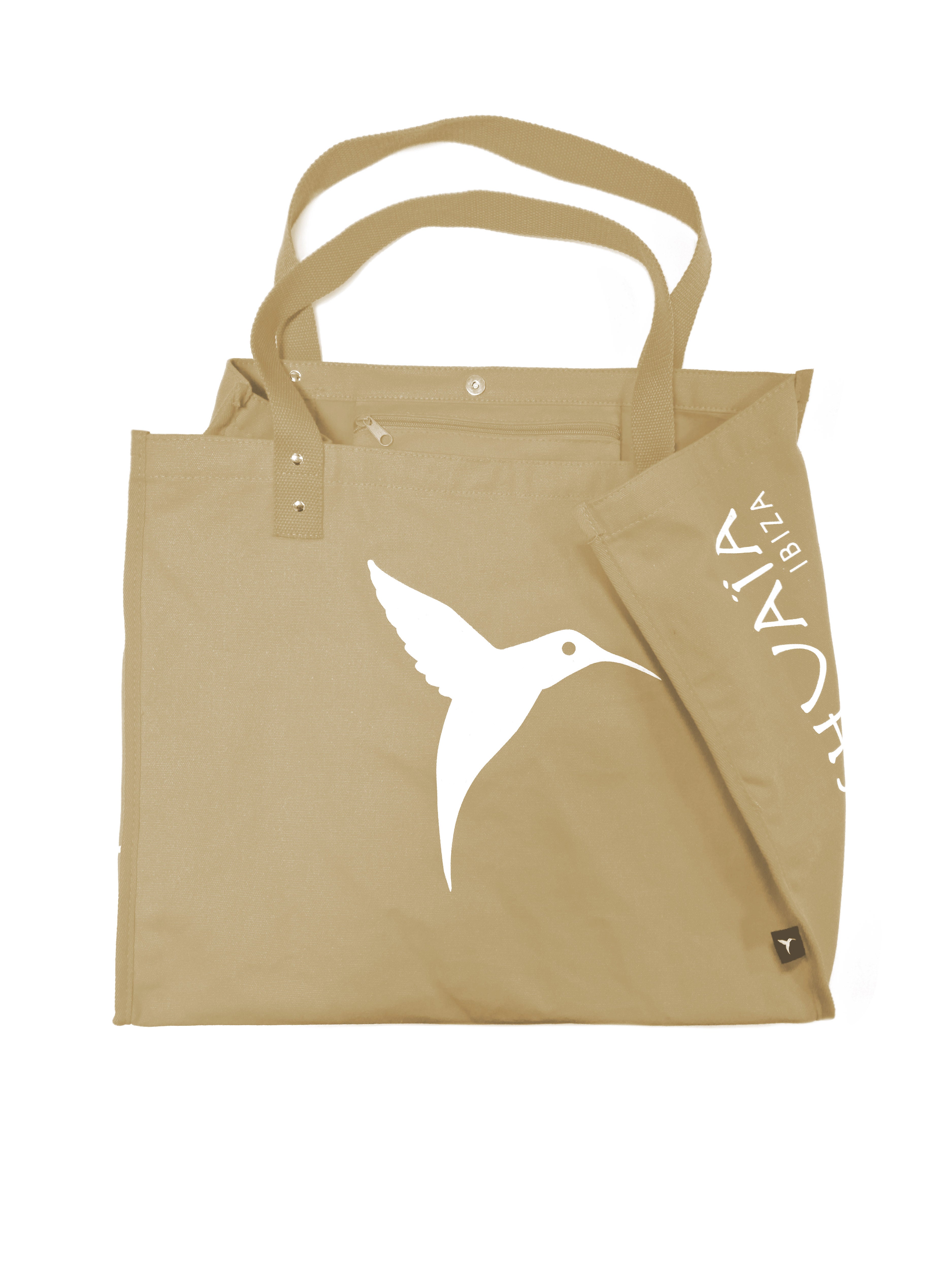 Beige Ushuaïa Ibiza beach bag with white hummingbird print and double cotton handles.