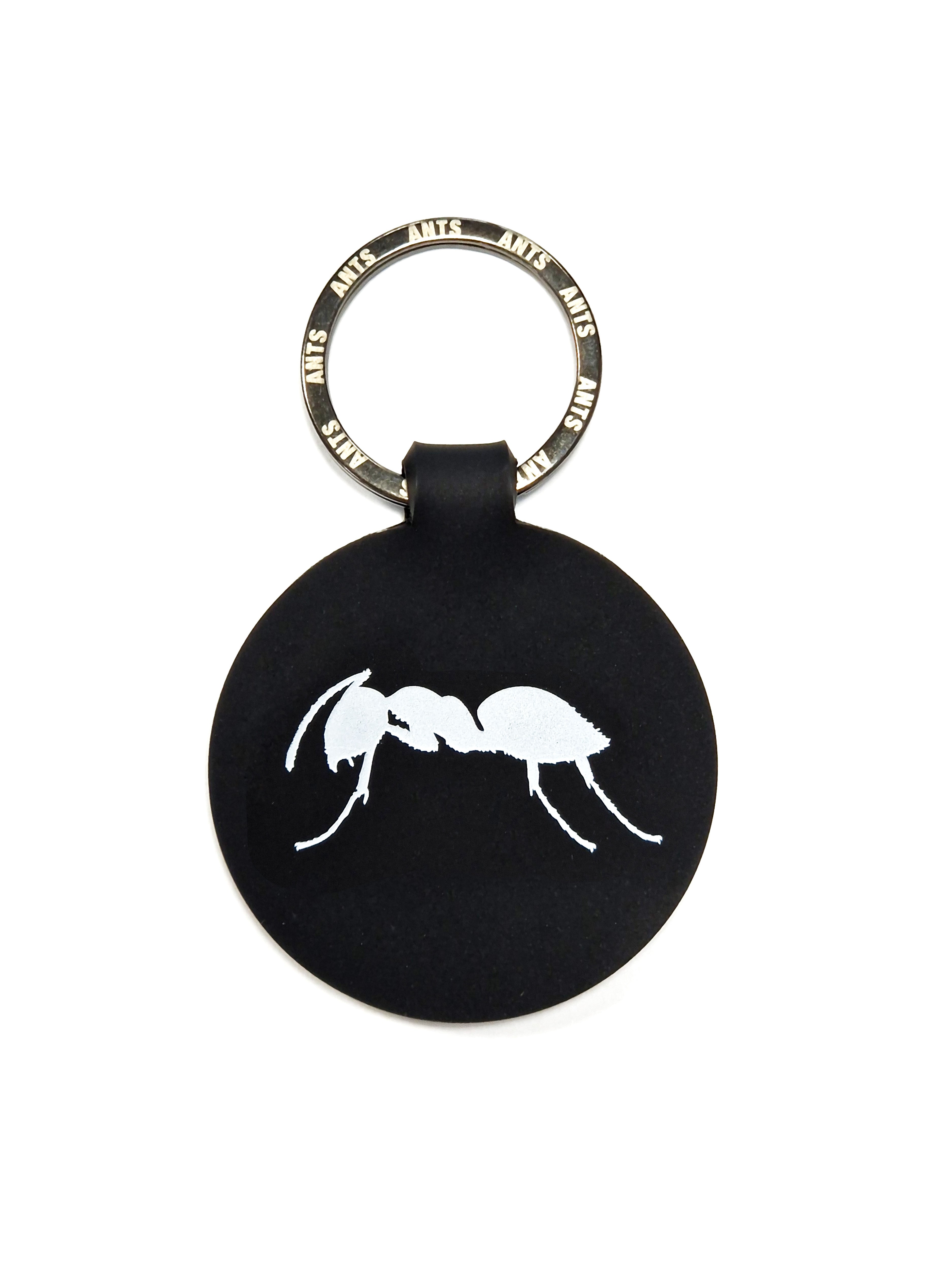 KEYRING ROUND ANTS | Black round keyring with ANTS logo on both sides. Lightweight, durable, and practical for everyday use.