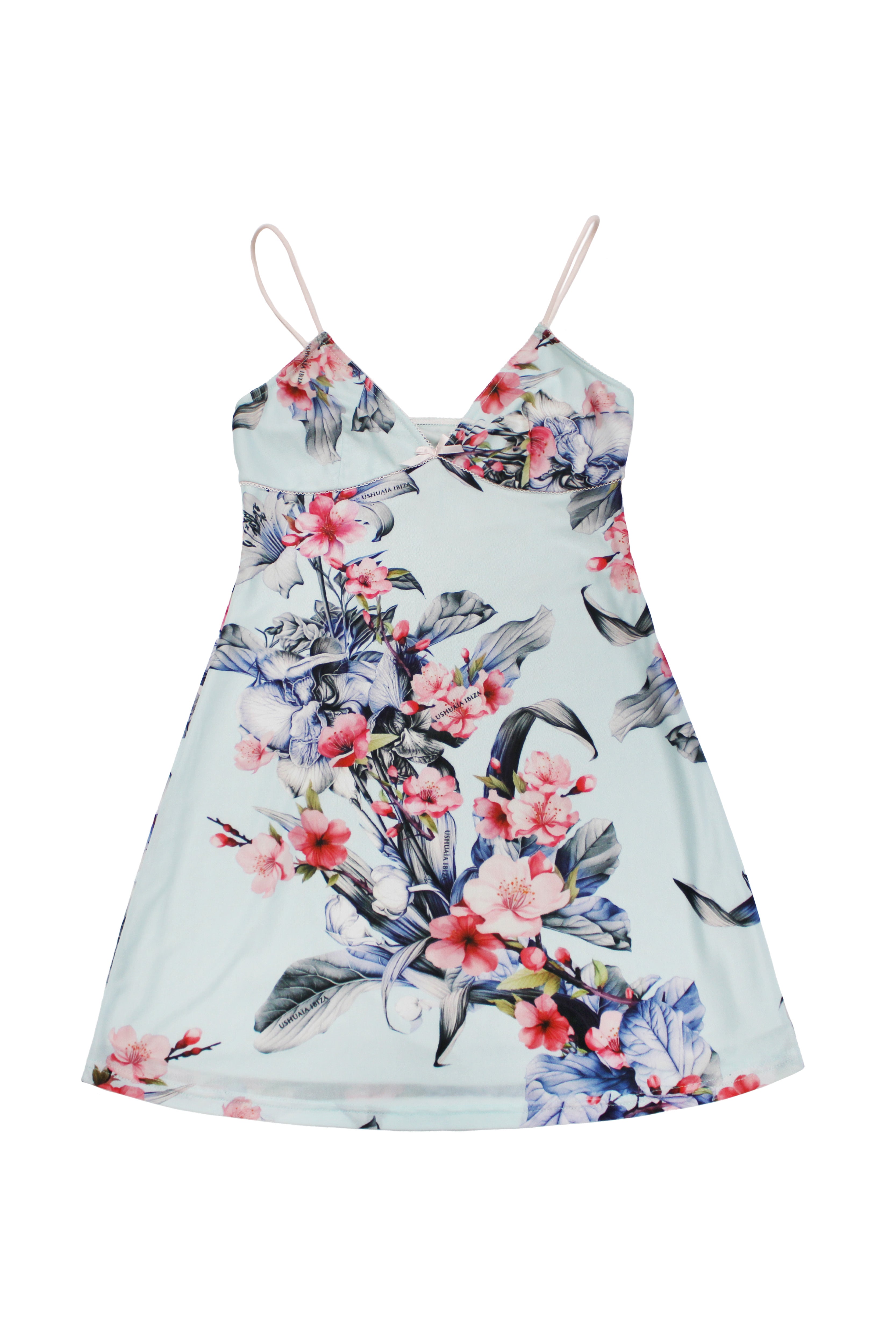 Elastic printed slip dress with lining. Adjustable straps. Bow detail with metallic ornament on neckline and hem opening.