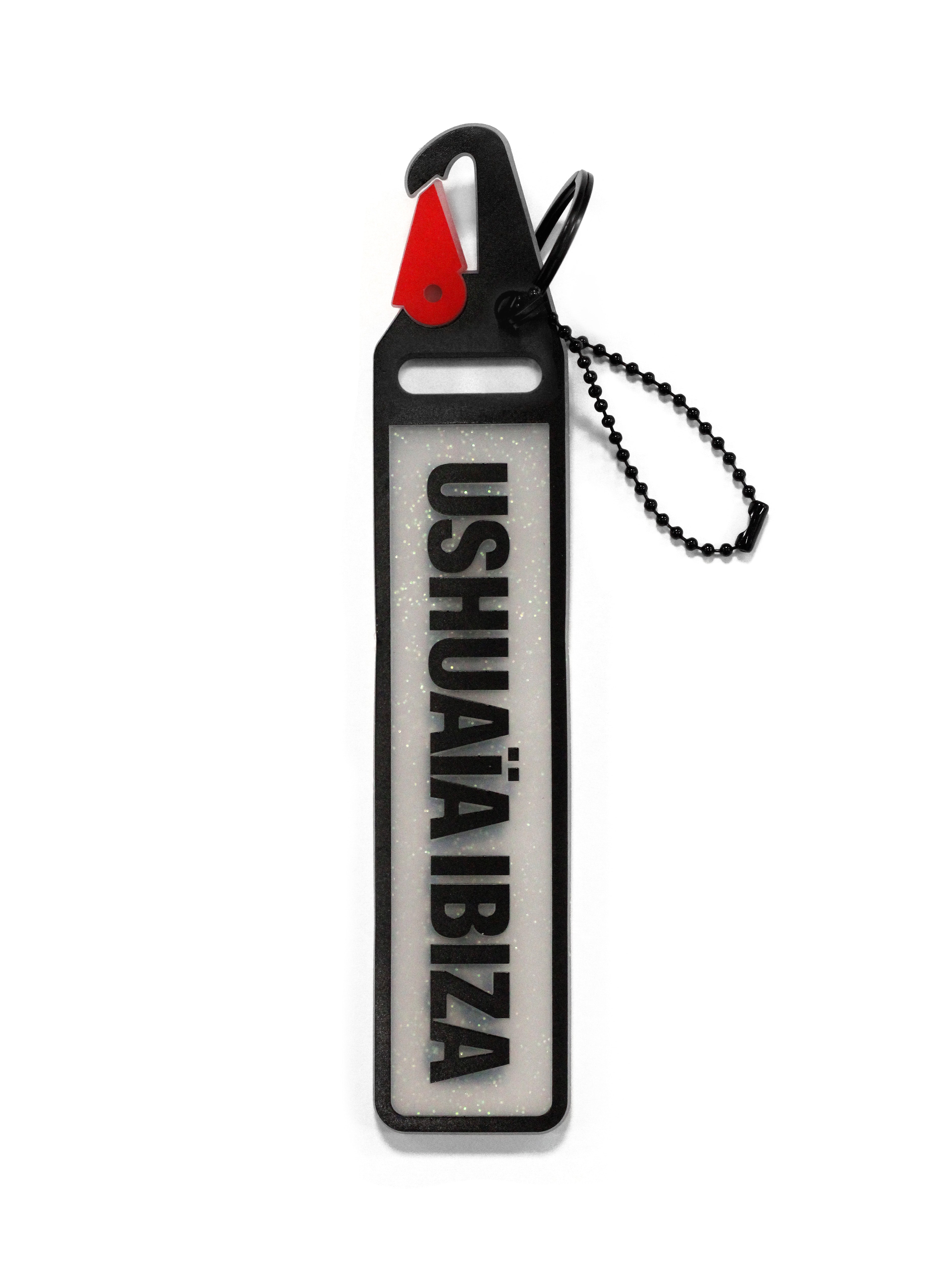 Translucent Ushuaïa Ibiza keychain with integrated hook and black logo