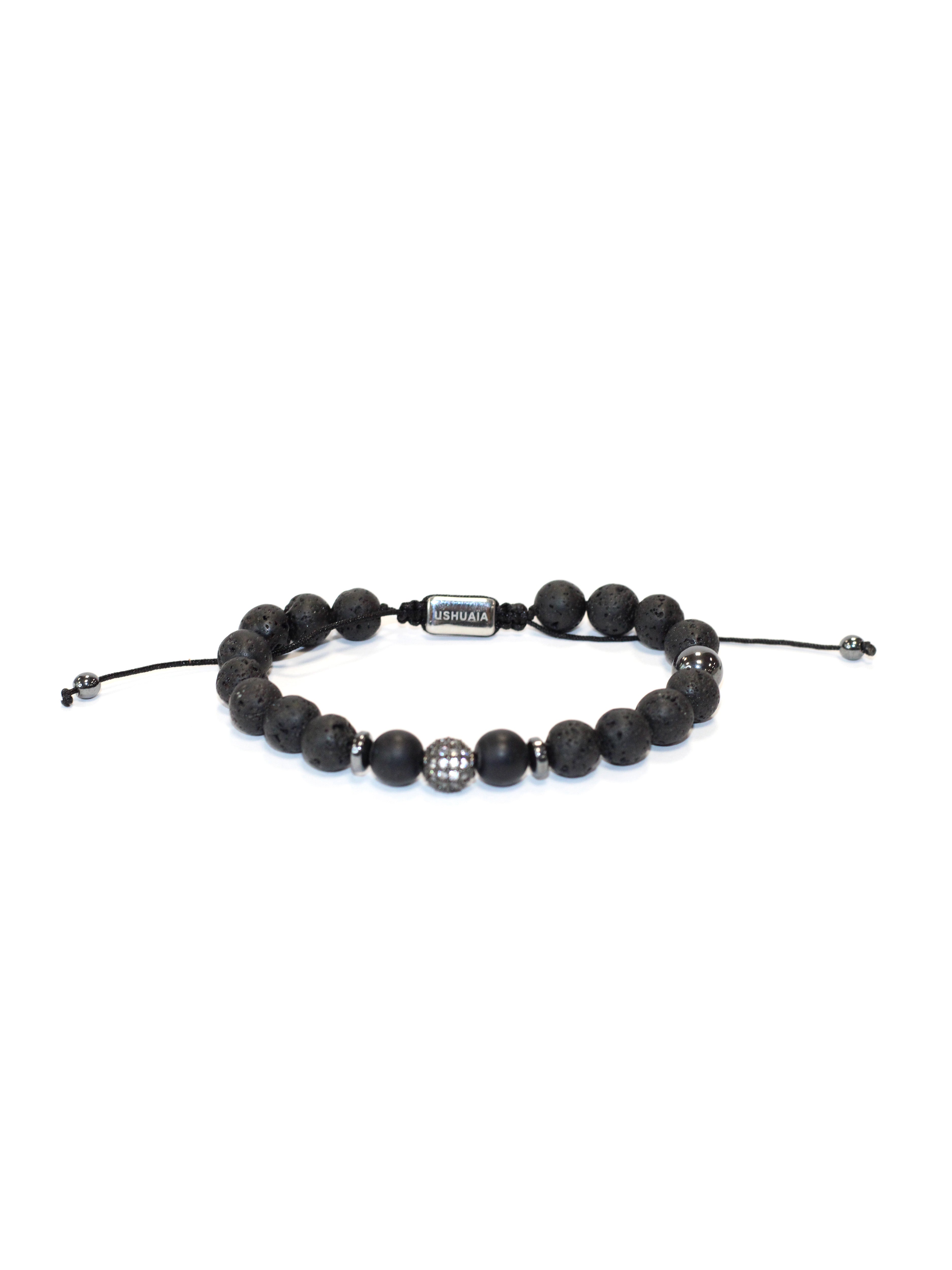 Adjustable bracelet with waxed cord. Black volcanic stone and metal beads. Central detail with inlays and engraved Ushuaïa metal tag. One size, unisex design.
COMPOSITION:
volcanic stone, metal alloy, textile cord.