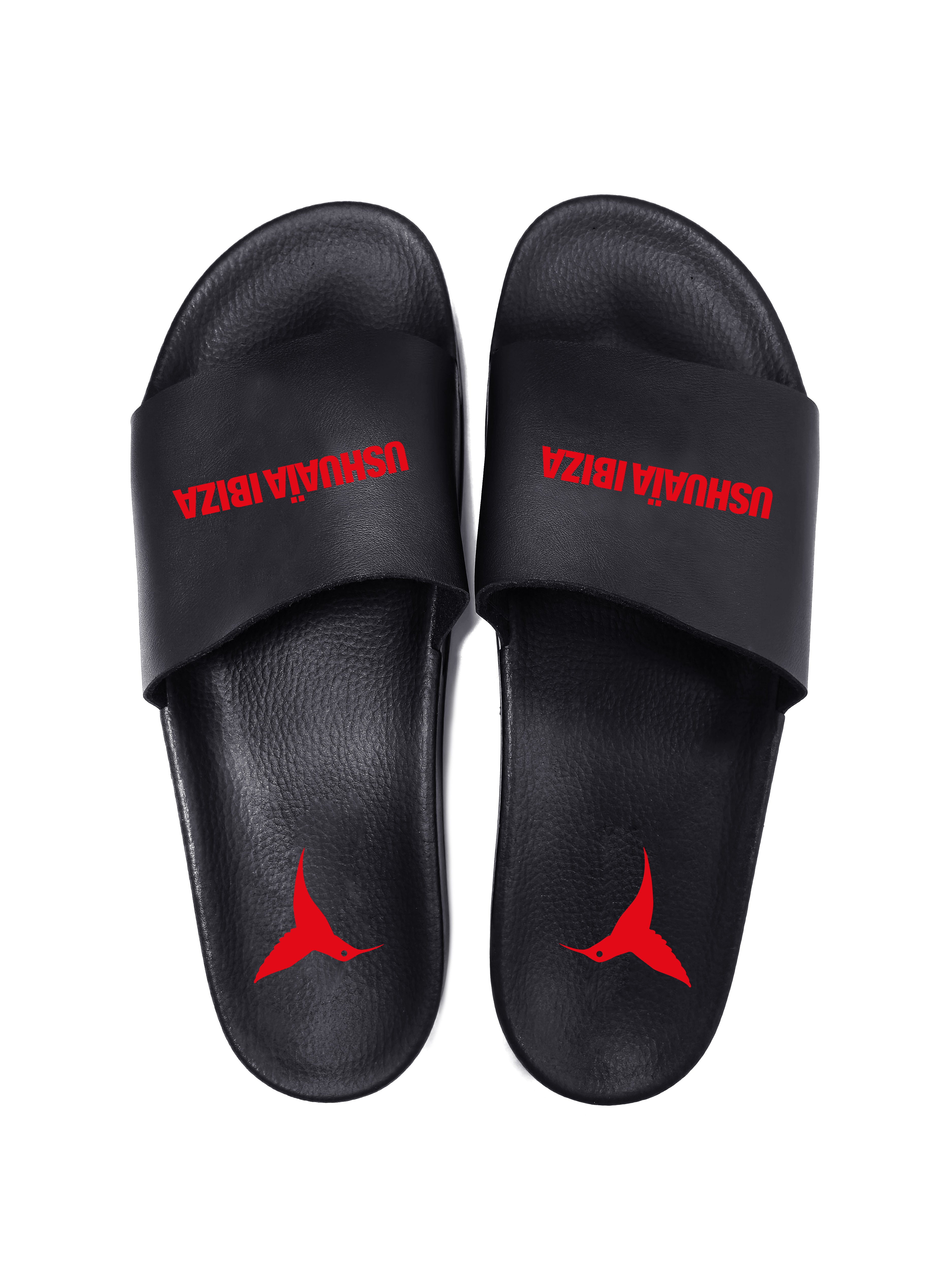 Black flip flops with red logo.Polyurethane sole with cotton and polyester lining.Screen printing and engraving in high frecuency.