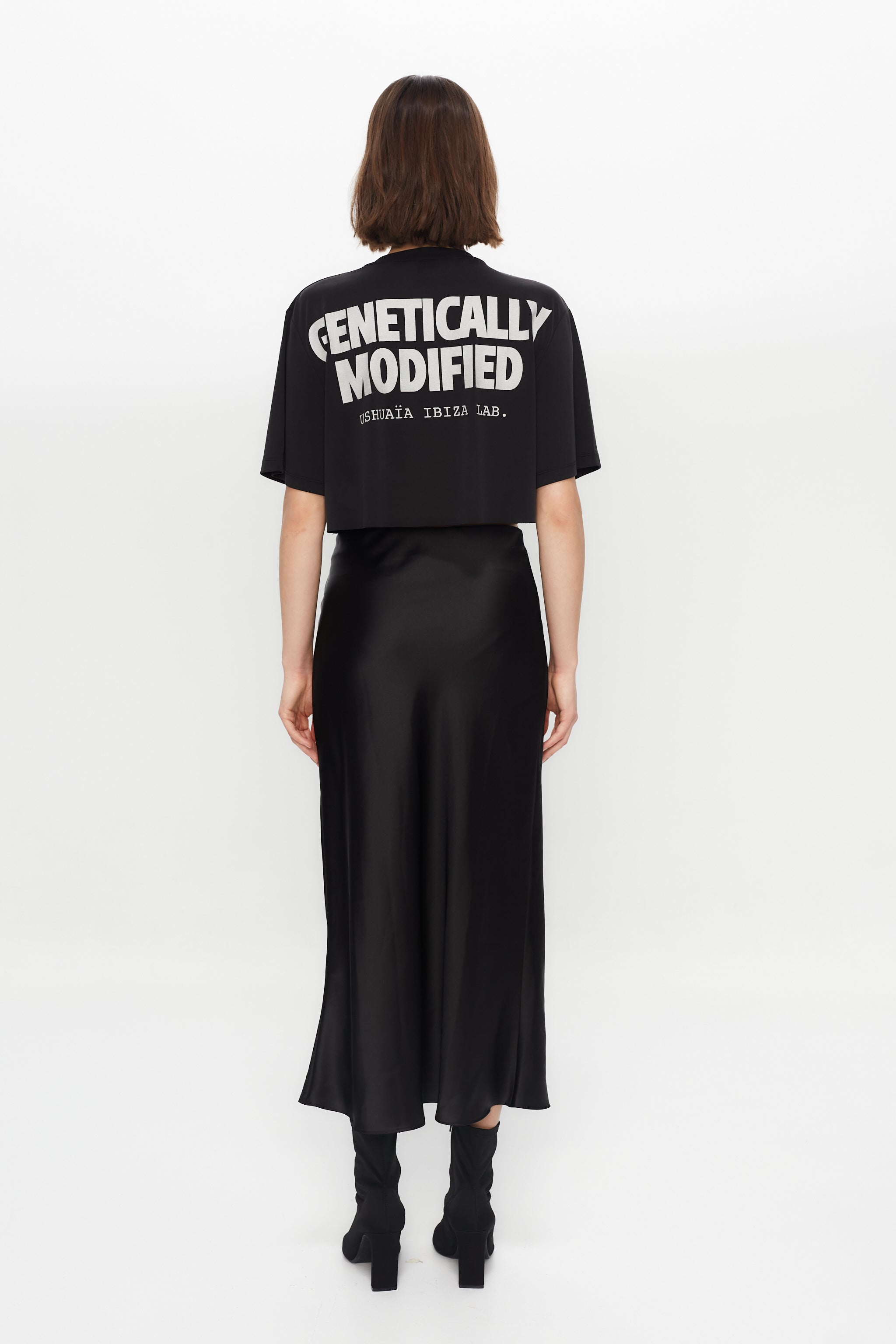 Black cropped T-shirt with metallic finish, bold front print & chain details. Perfect for edgy Ibiza vibes. Shop the trend now!