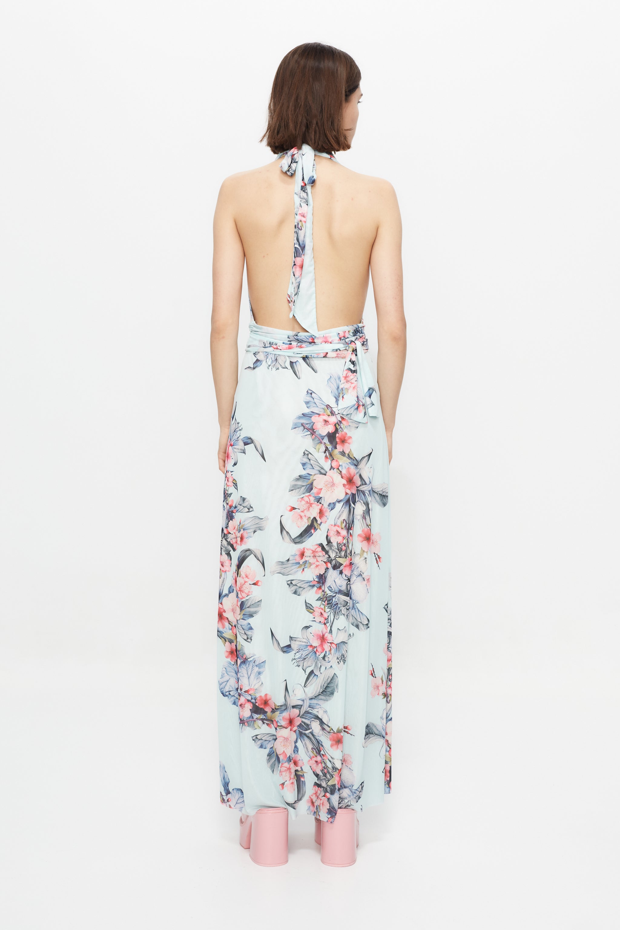 Long multi-position dress with all-over print finish and side slit.