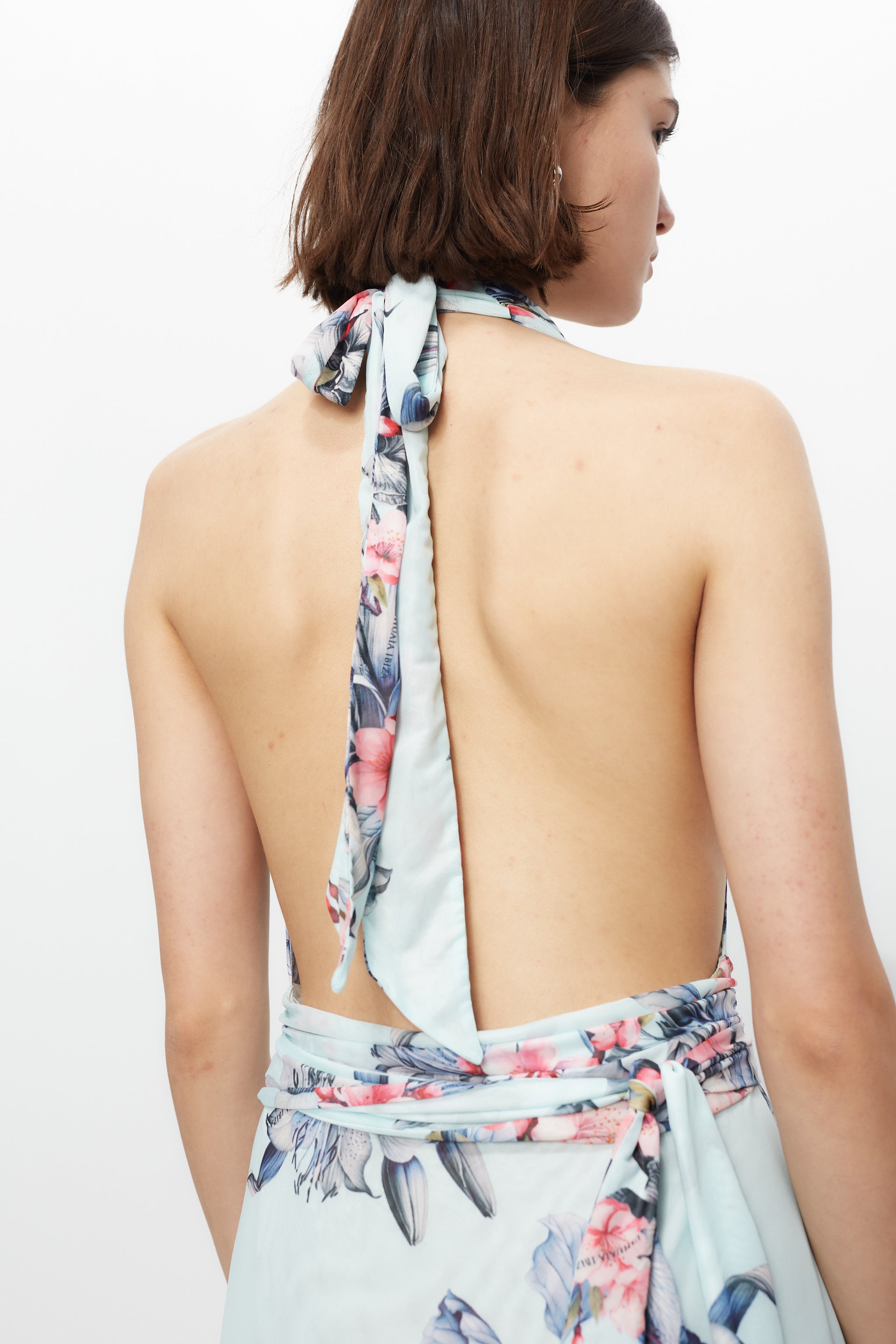 Long multi-position dress with all-over print finish and side slit.