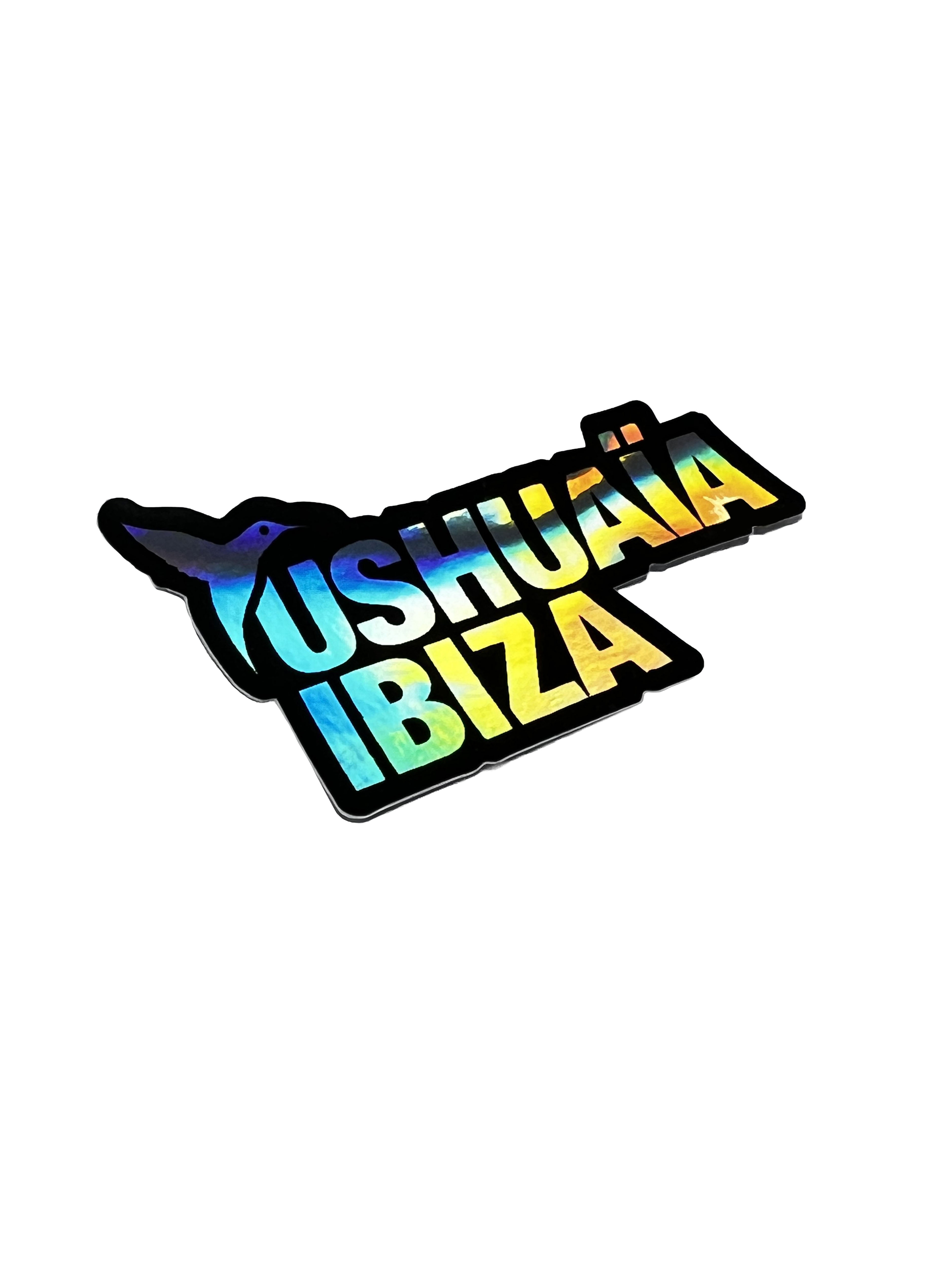 Multicolor holographic Ushuaïa Ibiza logo sticker.