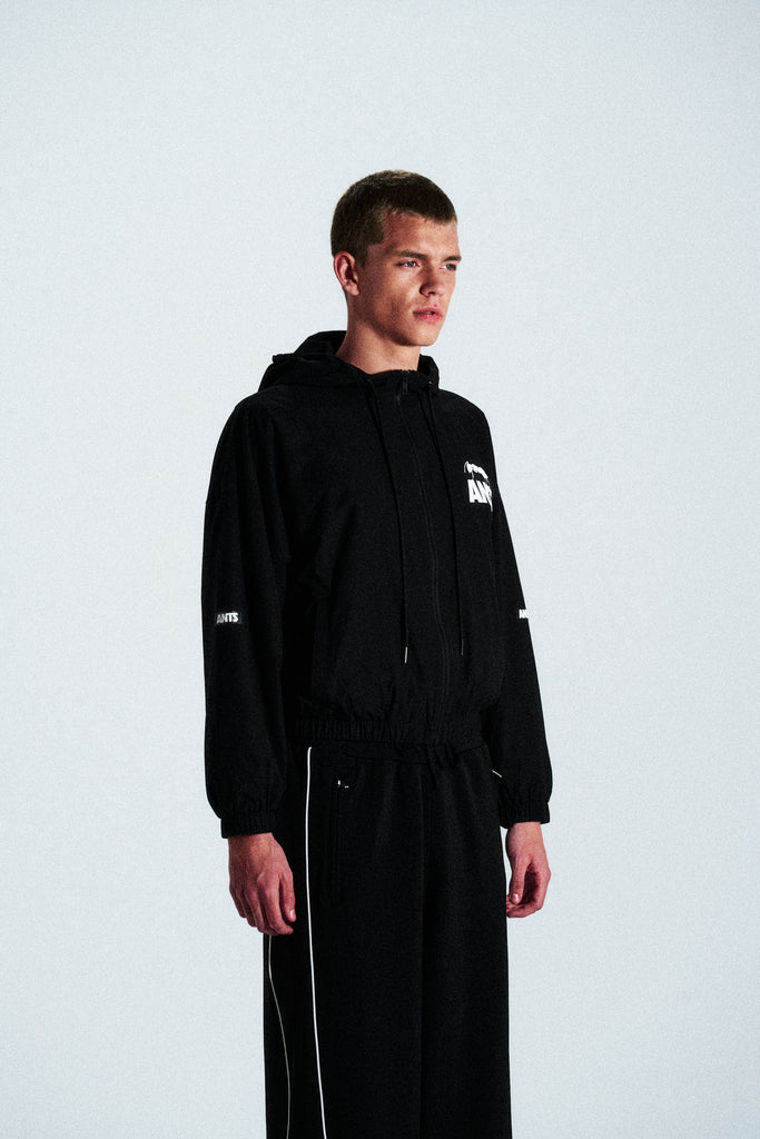 Minimal black hoodie from the ANTS collection. Cut from 100% French terry cotton with a clean front graphic. Timeless and relaxed streetwear piece.