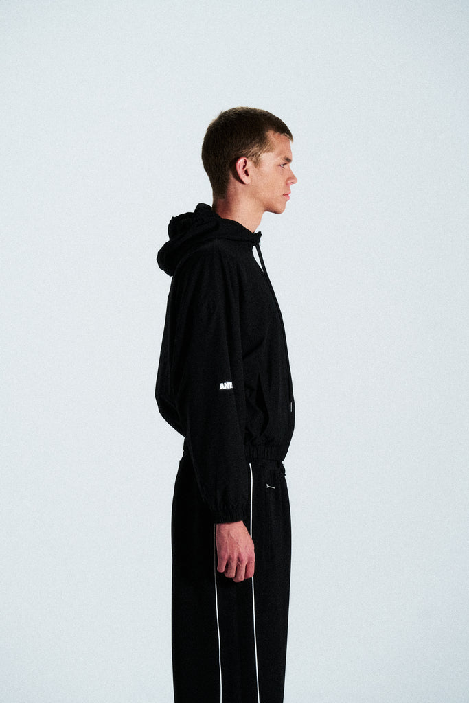 Minimal black hoodie from the ANTS collection. Cut from 100% French terry cotton with a clean front graphic. Timeless and relaxed streetwear piece.