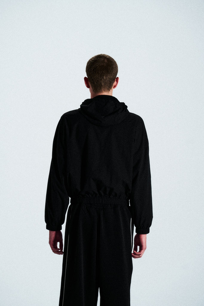 Minimal black hoodie from the ANTS collection. Cut from 100% French terry cotton with a clean front graphic. Timeless and relaxed streetwear piece.