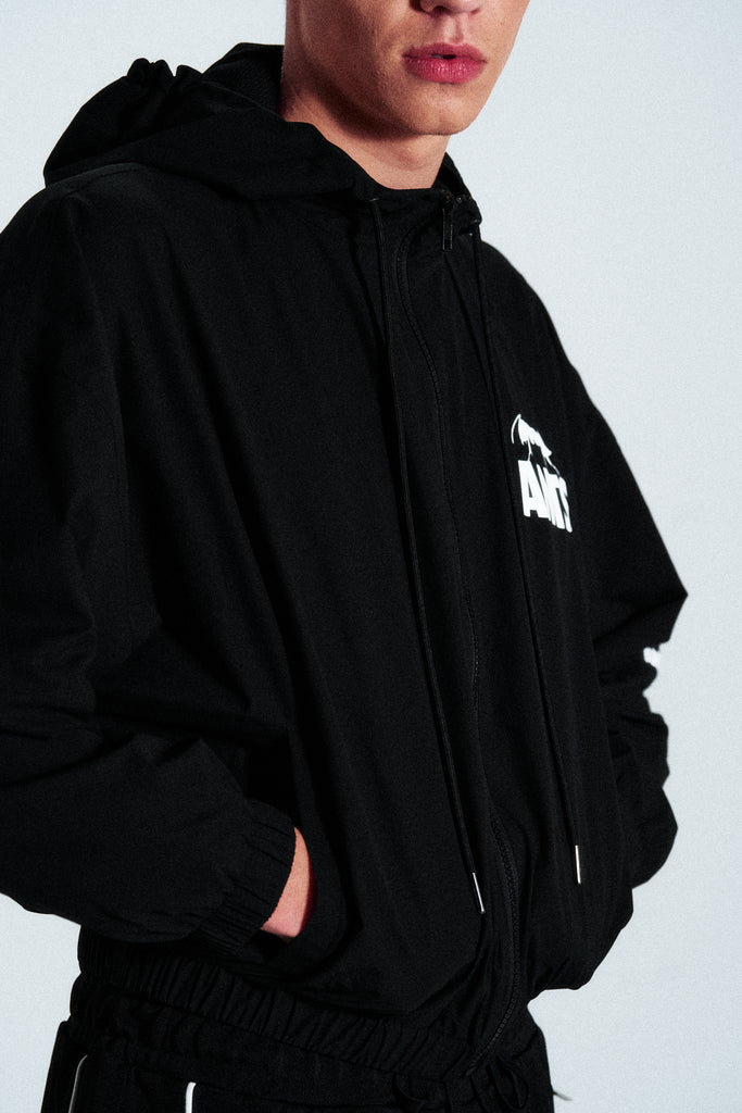 Minimal black hoodie from the ANTS collection. Cut from 100% French terry cotton with a clean front graphic. Timeless and relaxed streetwear piece.