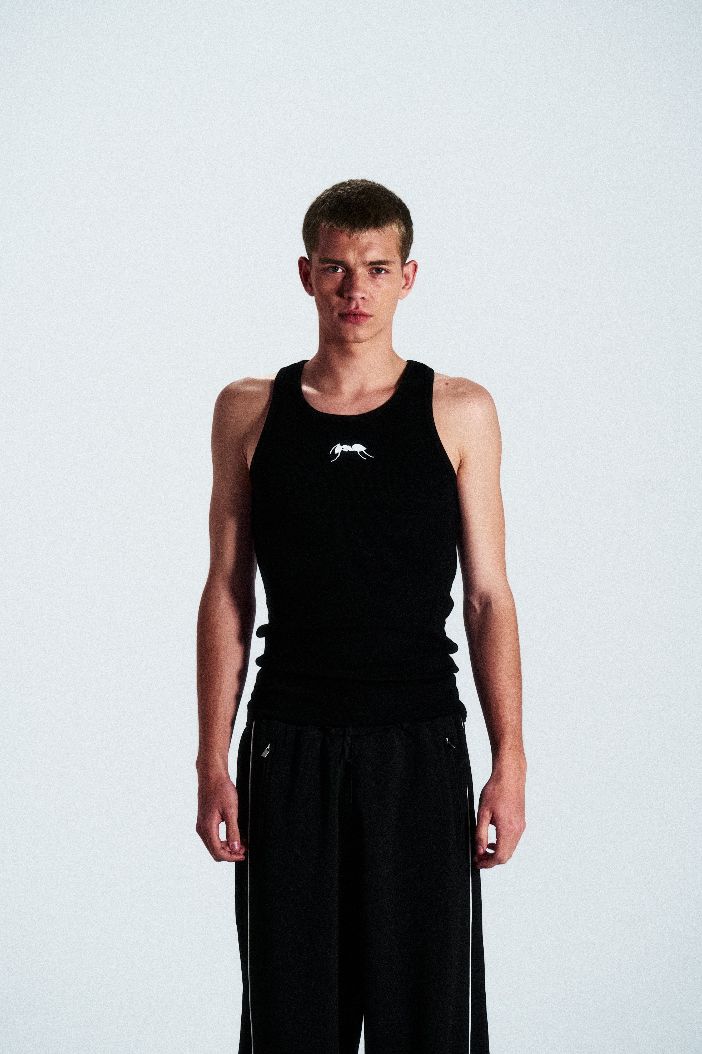 Fitted ribbed vest featuring the ANTS logo. Soft stretch cotton for maximum comfort and mobility. Limited edition, ships worldwide.