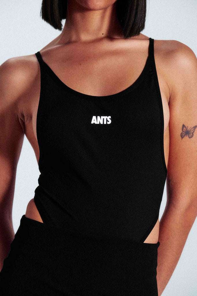 Stretch strap bodysuit made from technical fabric: 75% nylon and 25% elastane. Slim fit design with ANTS logo on the front