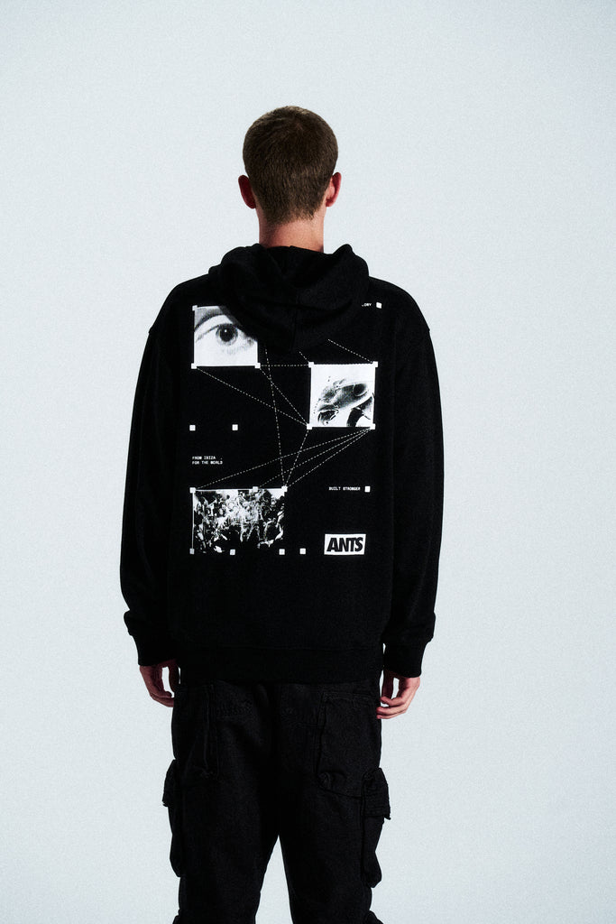 The Built Stronger Hoodie is crafted from French Terry Cotton. The black hoodie is emblazoned with a white ANTS logo on the front and features artwork on the back. A unique piece of merchandise and a versatile addition to any outfit.