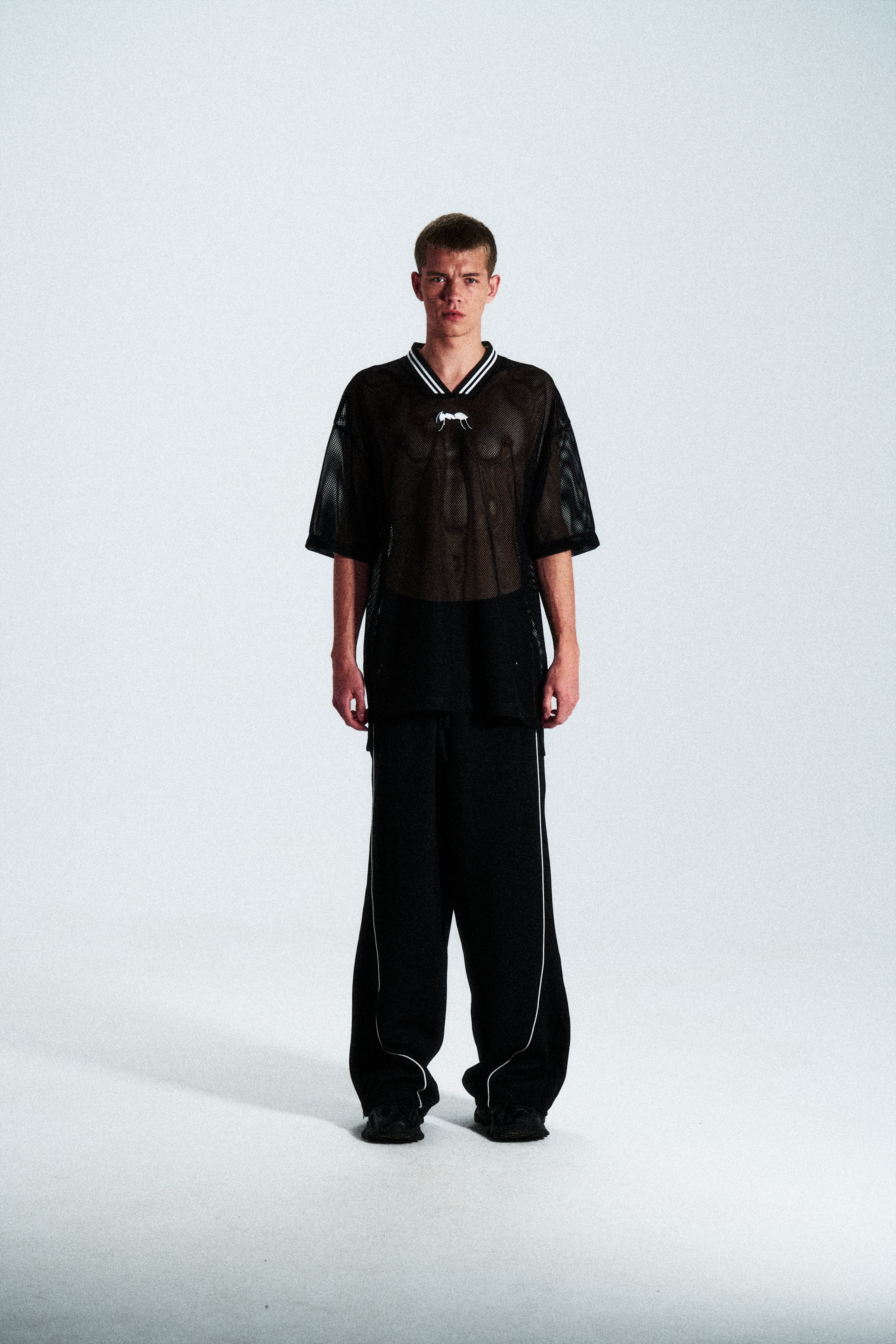 Short-sleeve sports jersey made of 100% polyester mesh. Lightweight, breathable, and quick-drying. White ANTS logos on front and back. Straight cut with comfortable fit.