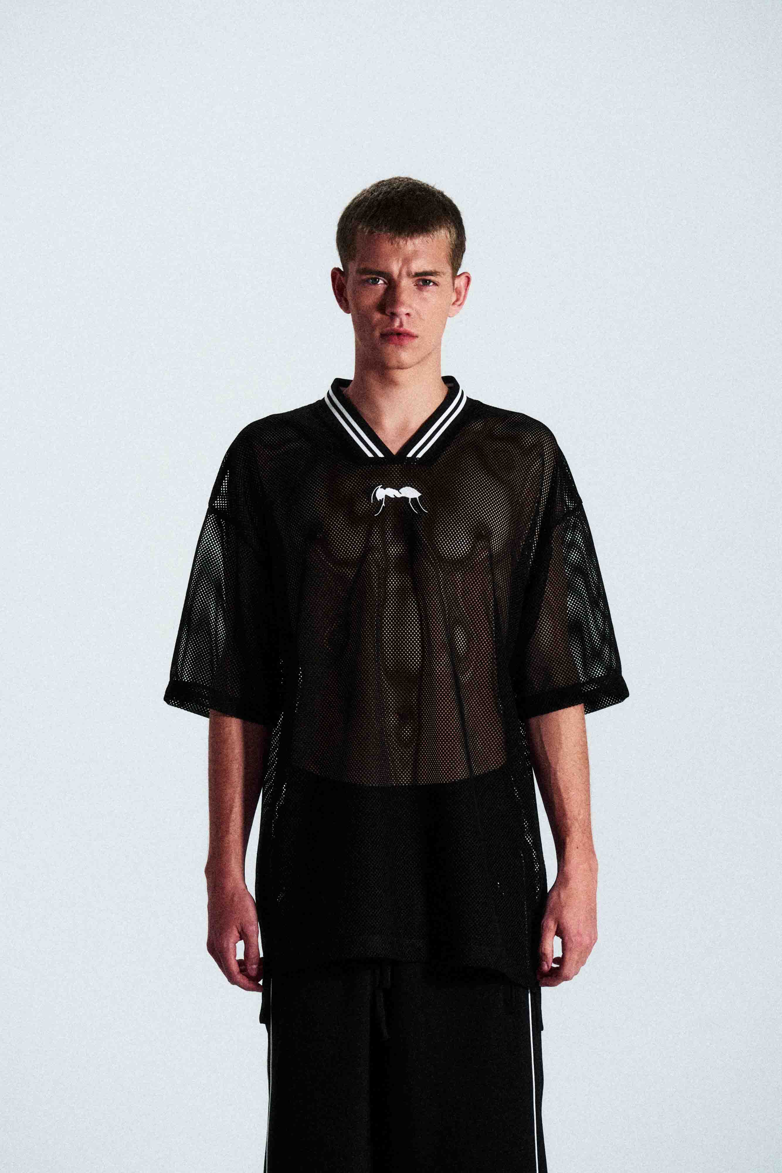 Short-sleeve sports jersey made of 100% polyester mesh. Lightweight, breathable, and quick-drying. White ANTS logos on front and back. Straight cut with comfortable fit.