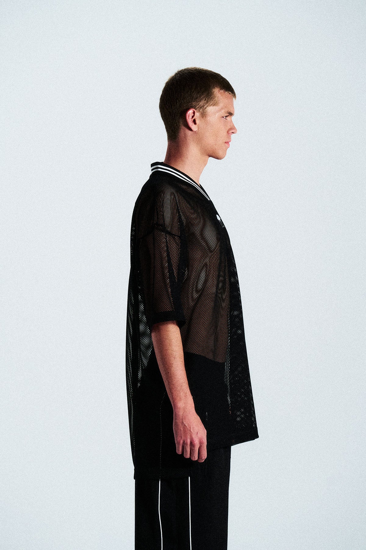 Short-sleeve sports jersey made of 100% polyester mesh. Lightweight, breathable, and quick-drying. White ANTS logos on front and back. Straight cut with comfortable fit.