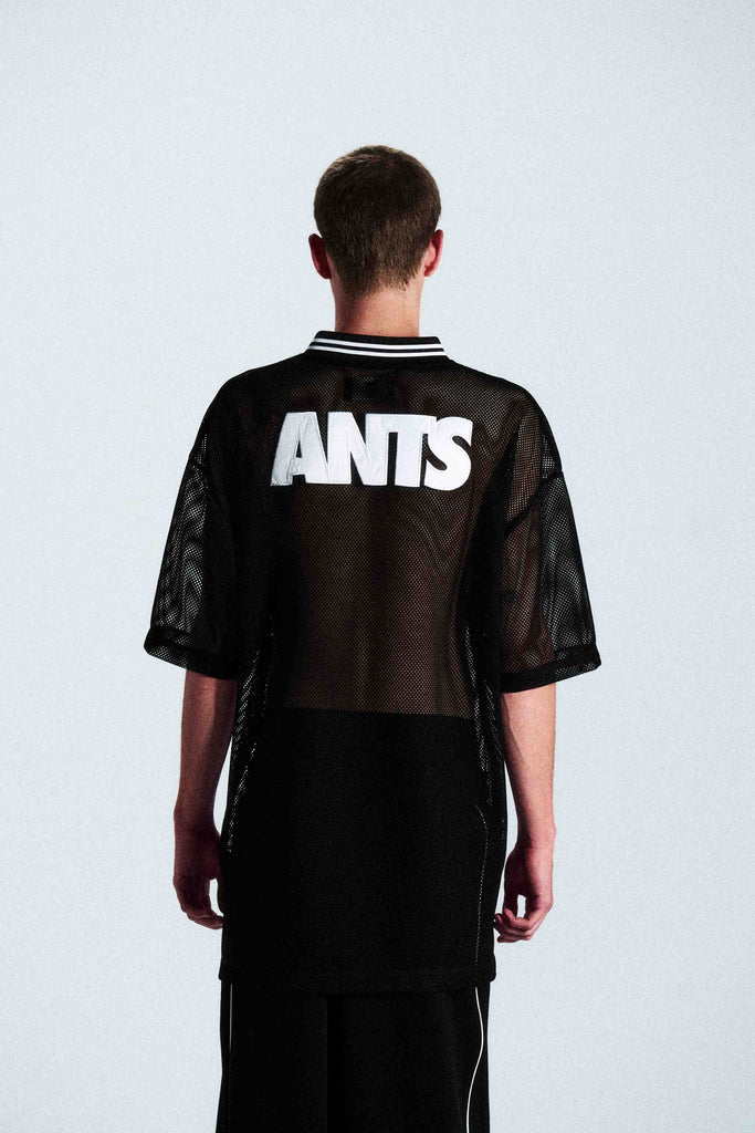 Short-sleeve sports jersey made of 100% polyester mesh. Lightweight, breathable, and quick-drying. White ANTS logos on front and back. Straight cut with comfortable fit.