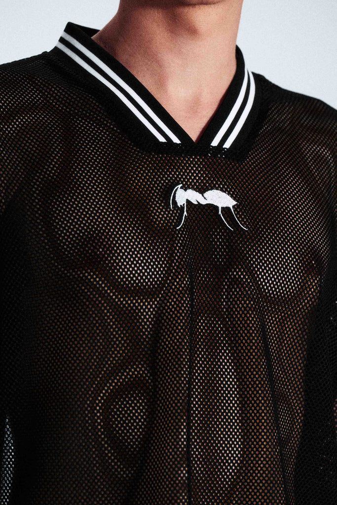 Short-sleeve sports jersey made of 100% polyester mesh. Lightweight, breathable, and quick-drying. White ANTS logos on front and back. Straight cut with comfortable fit.