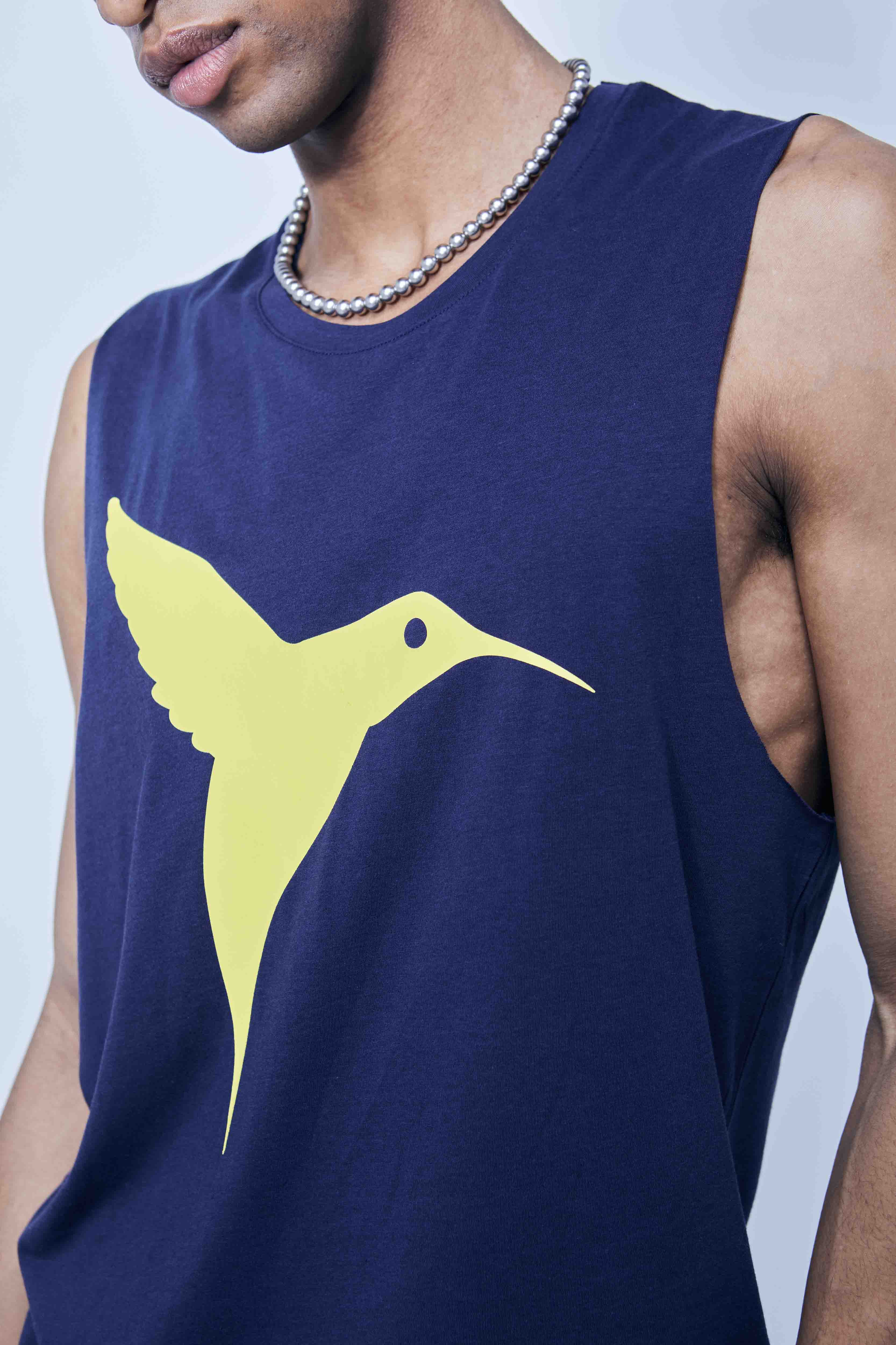 Round neck T-shirt with washed armhole sleeves with a fade out effect. Contrasting combined print detail on the front and back. 