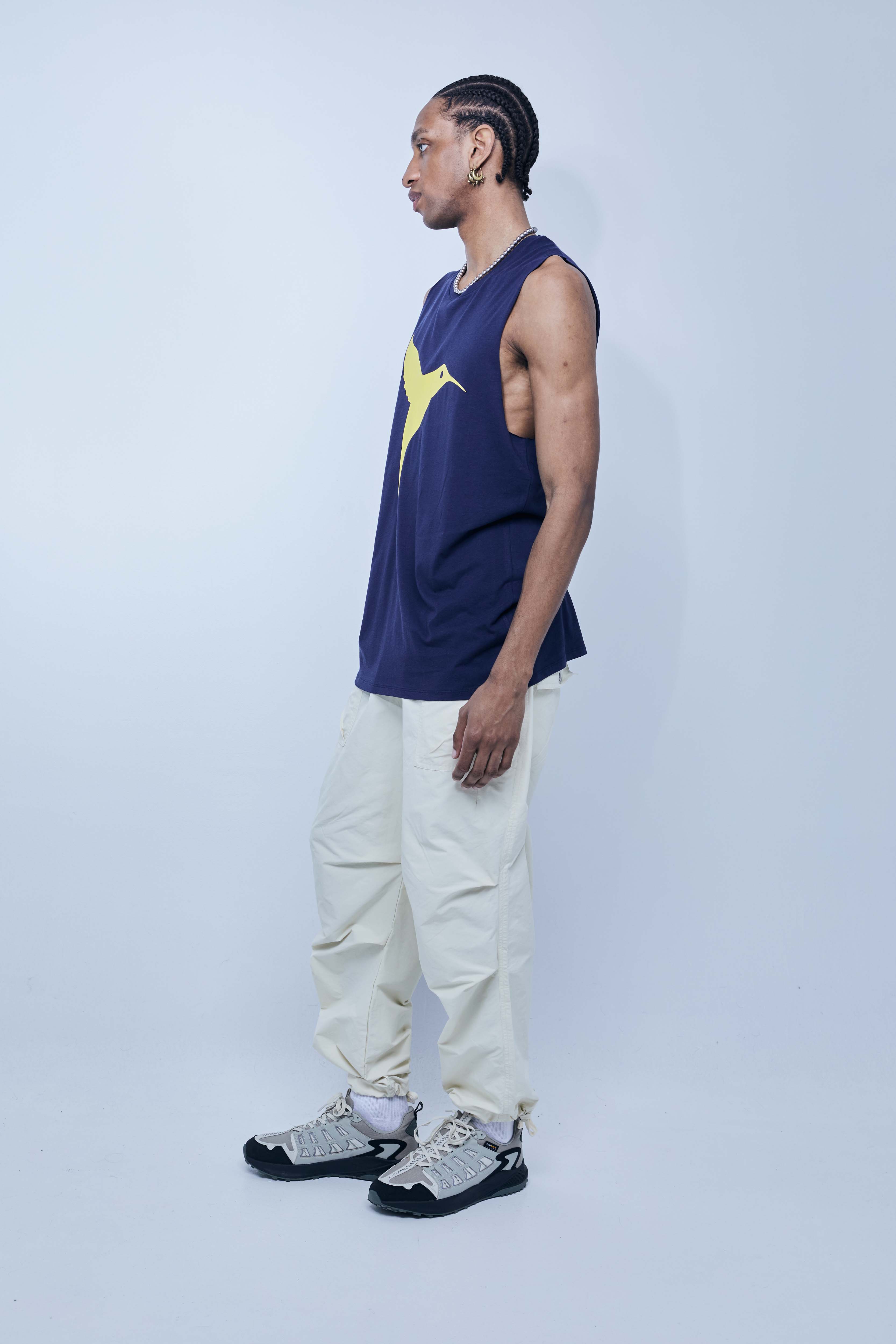 Round neck T-shirt with washed armhole sleeves with a fade out effect. Contrasting combined print detail on the front and back. 