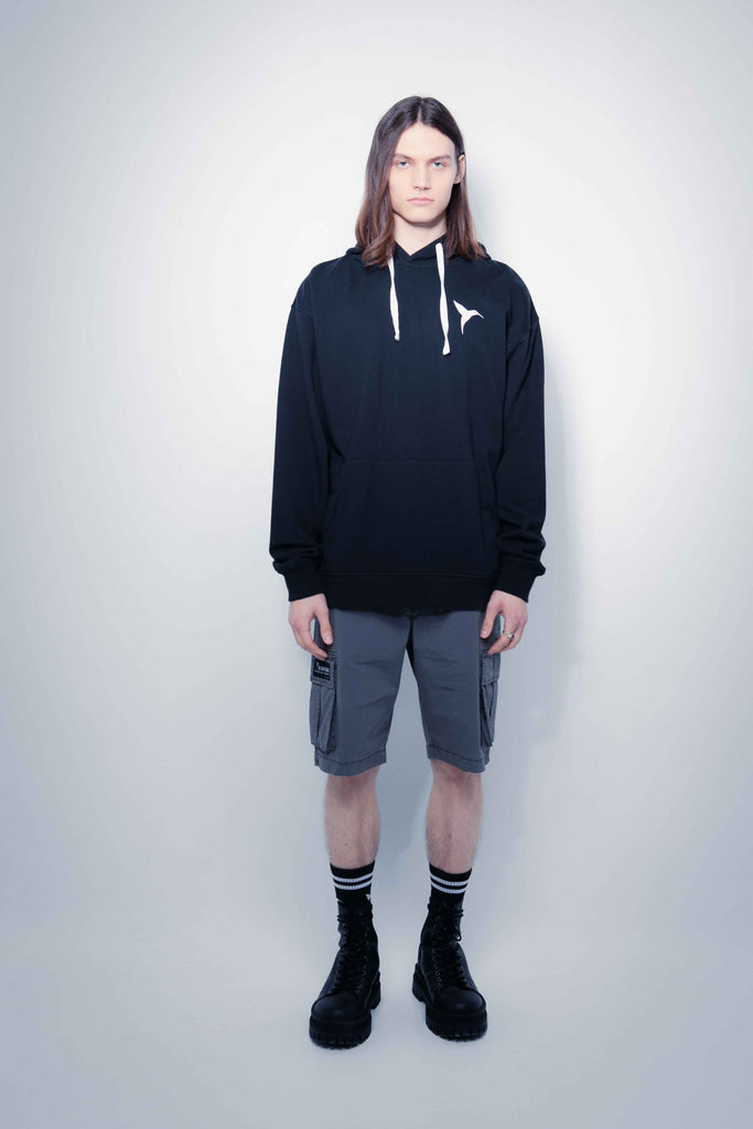 Oversized sweatshirt with adjustable drawstring hood and long sleeves. Combined print detail on the front and back. Kangaroo pocket on the front. Rib finishes