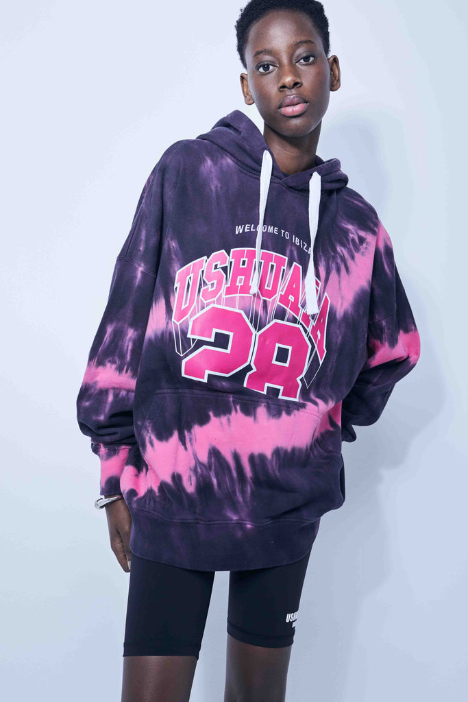 Washed long-sleeved hooded sweatshirt with tie-dye effect. Contrast combined print and embroidery detail on the front. Kangaroo pocket. Rib finishes.