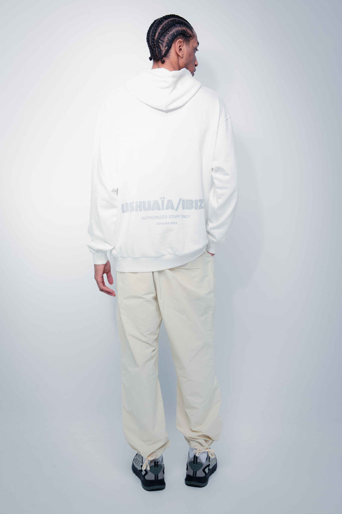 Oversized sweatshirt with adjustable drawstring hood and long sleeves. Contrast print detail on the front and back with reflective effect. Kangaroo pocket on the front. Rib finishes. 
