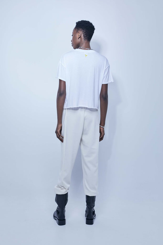 White T-shirt with oversized yellow and black Ibiza print – Ushuaïa summer streetwear essential.