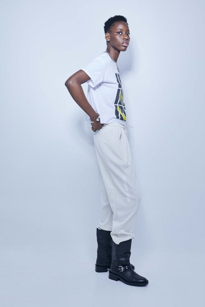 White T-shirt with oversized yellow and black Ibiza print – Ushuaïa summer streetwear essential.