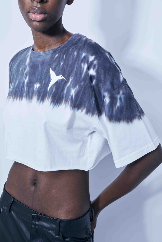 Black cropped T-shirt with tie-dye wash and contrast graphic details – Ushuaïa Ibiza streetwear style.