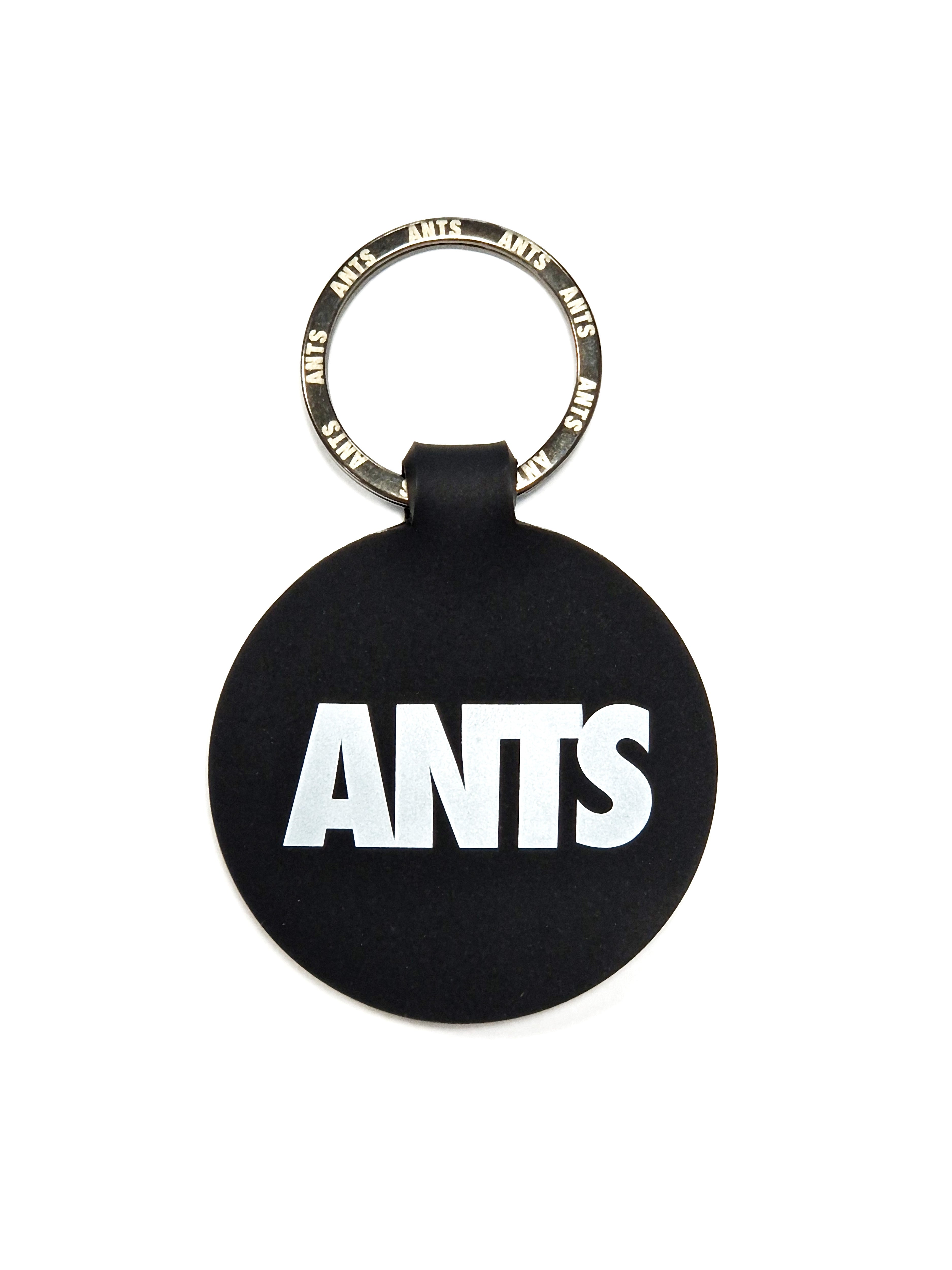 KEYRING ROUND ANTS | Black round keyring with ANTS logo on both sides. Lightweight, durable, and practical for everyday use.
