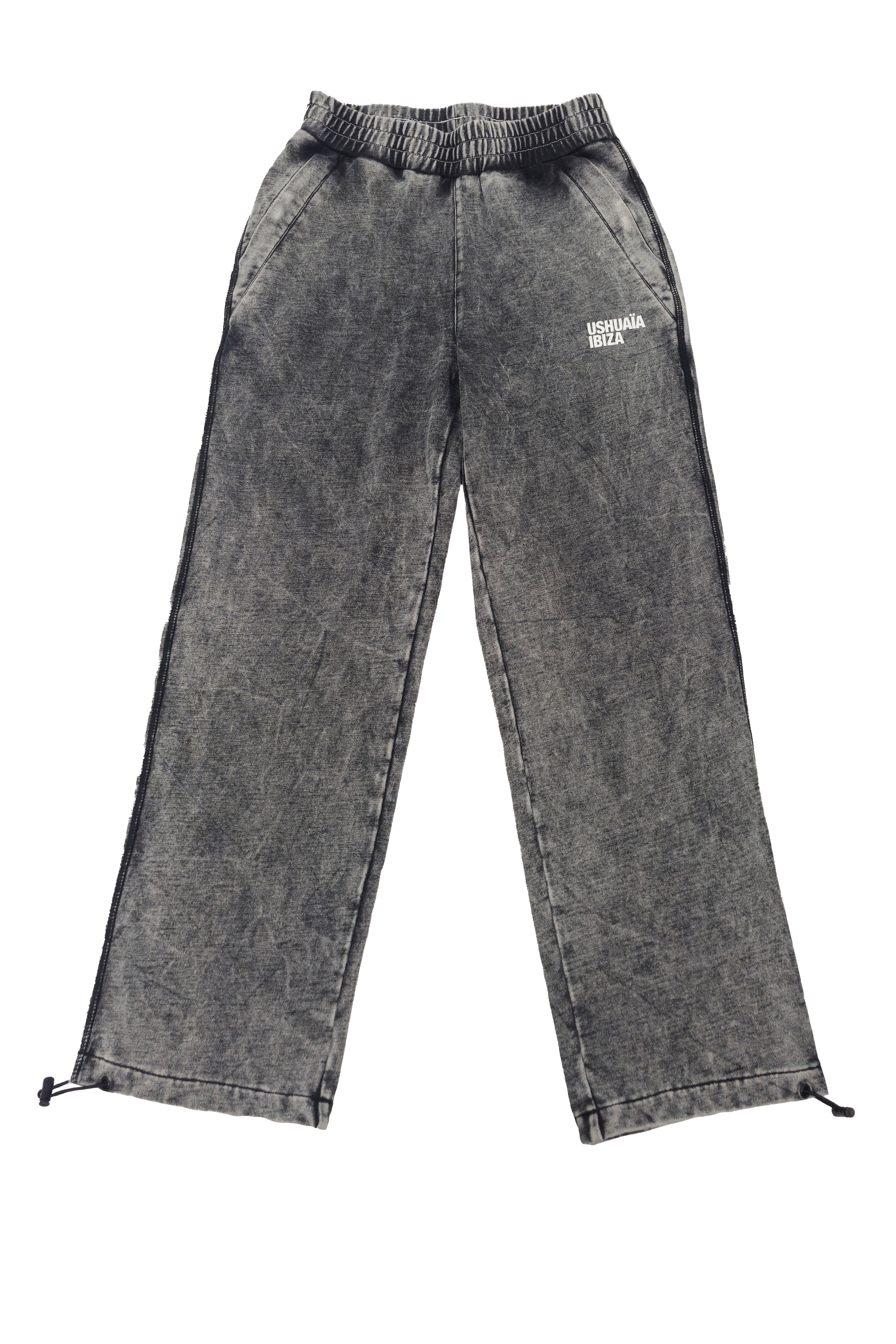 Wide-leg trousers with elastic waistband. Acid wash finish, contrast side print and reflective piping. Full-length design.
 