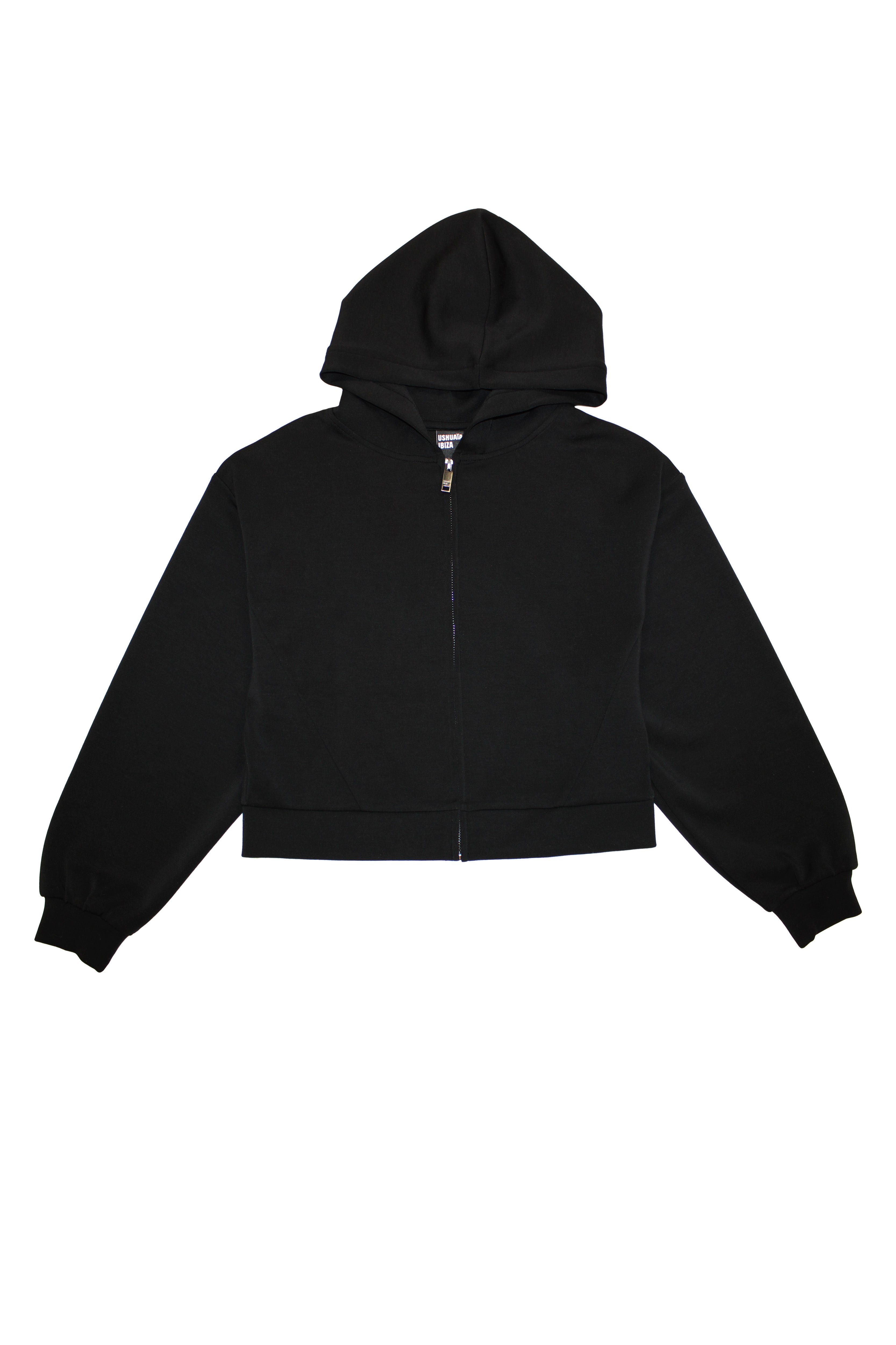 Cropped sweatshirt with hood and front closure. Features a reflective print detail on the back