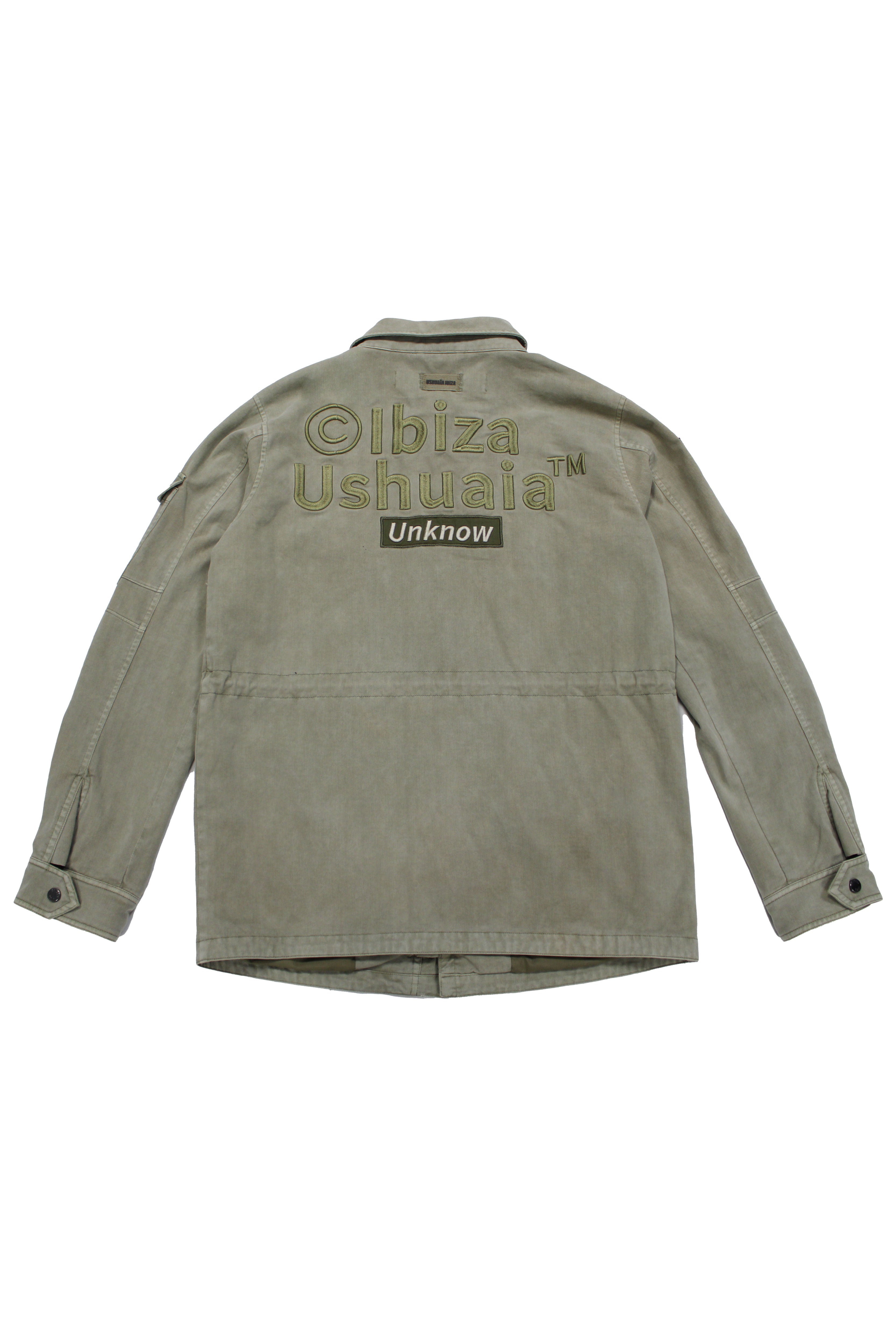 Washed twill military jacket with shirt collar and long sleeves with adjustable cuff with button. Central zip closure with adjustable drawstring at the waist. Patch pockets and flap on the front and sleeve. Combination of patches and embroidered application on front and back. Custom label detail on the back.