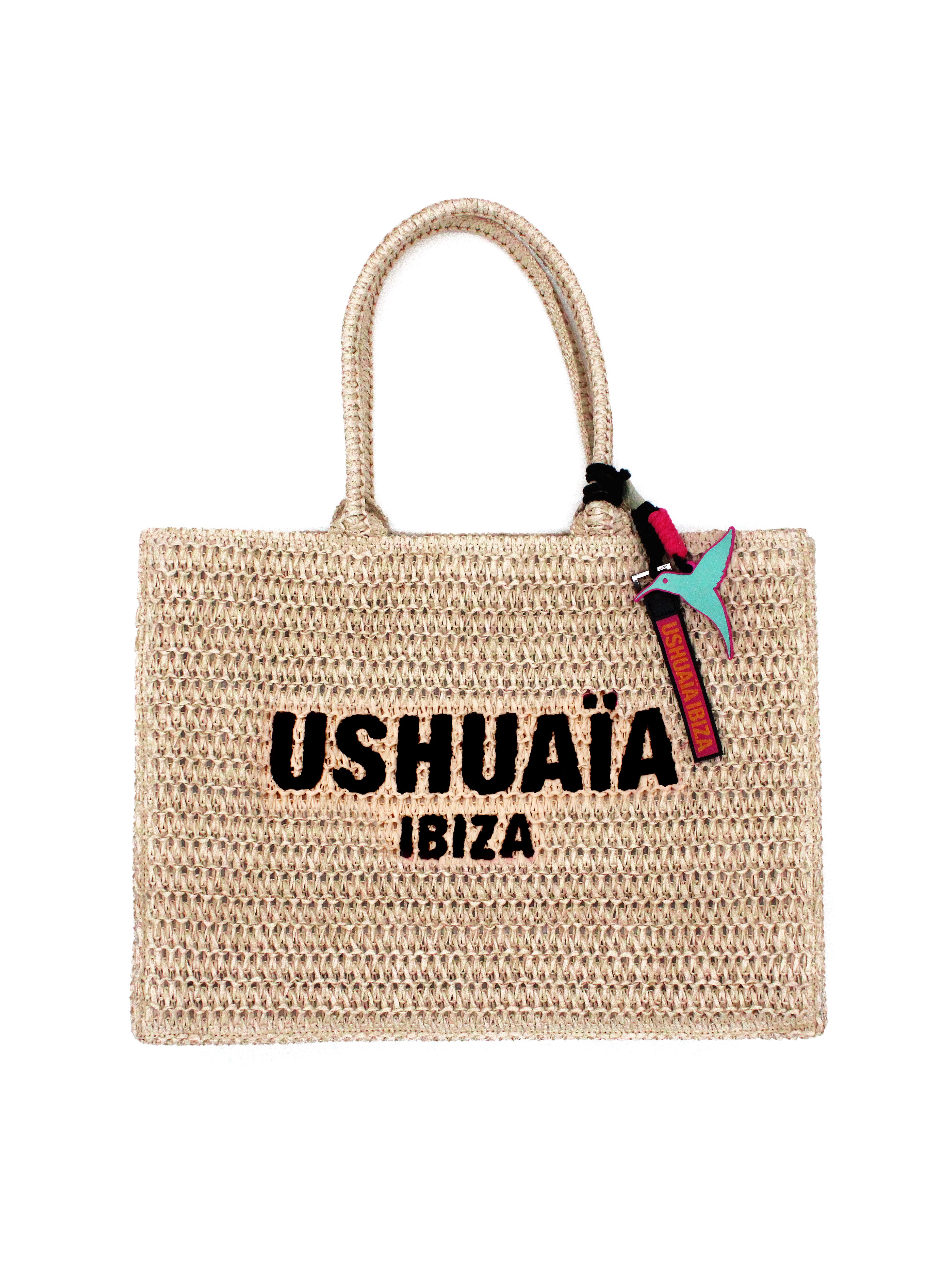 Bolso tote trenzado color natural con logo Ushuaïa Ibiza bordado en negro.