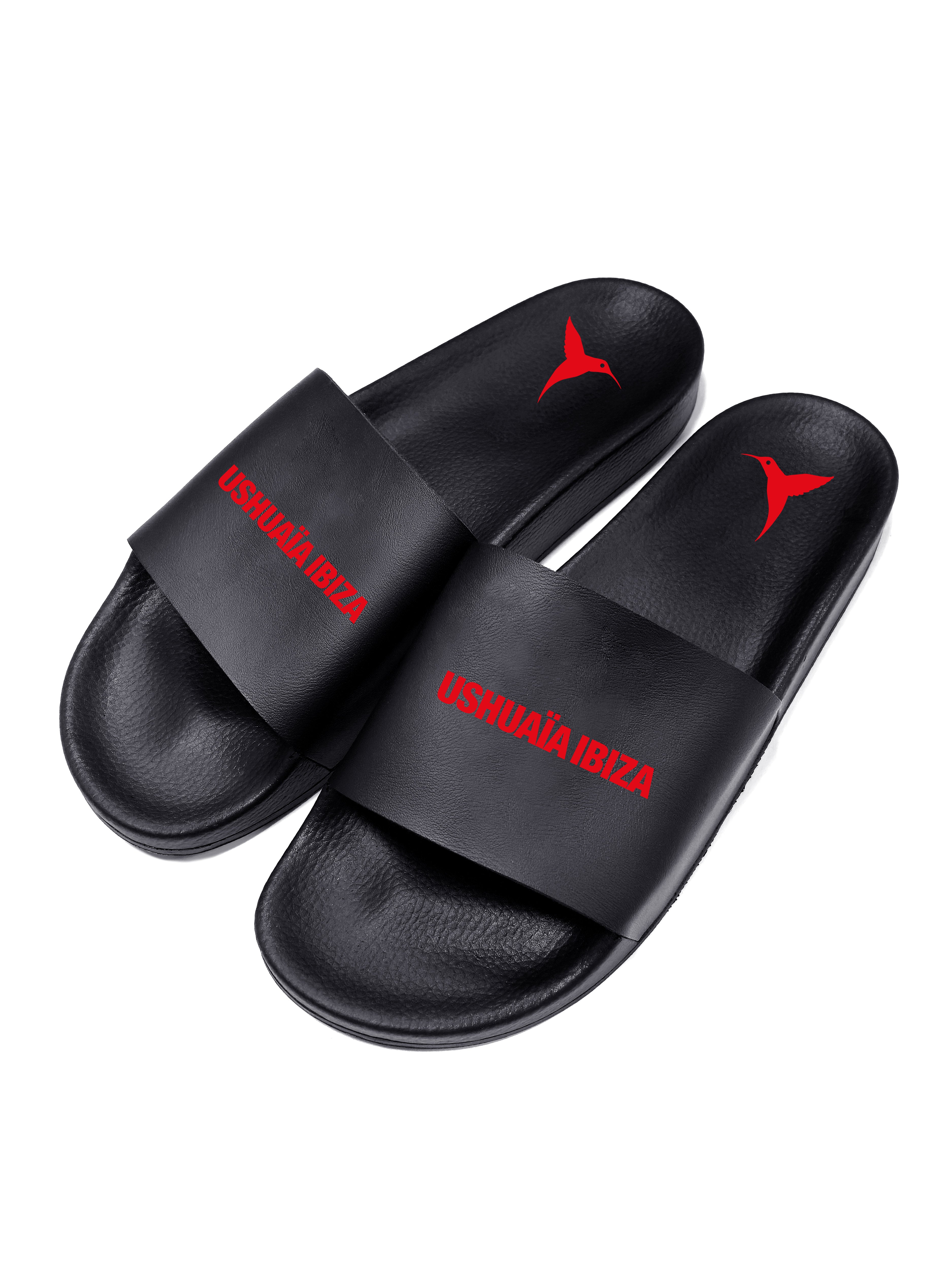 Black flip flops with red logo.Polyurethane sole with cotton and polyester lining.Screen printing and engraving in high frecuency.