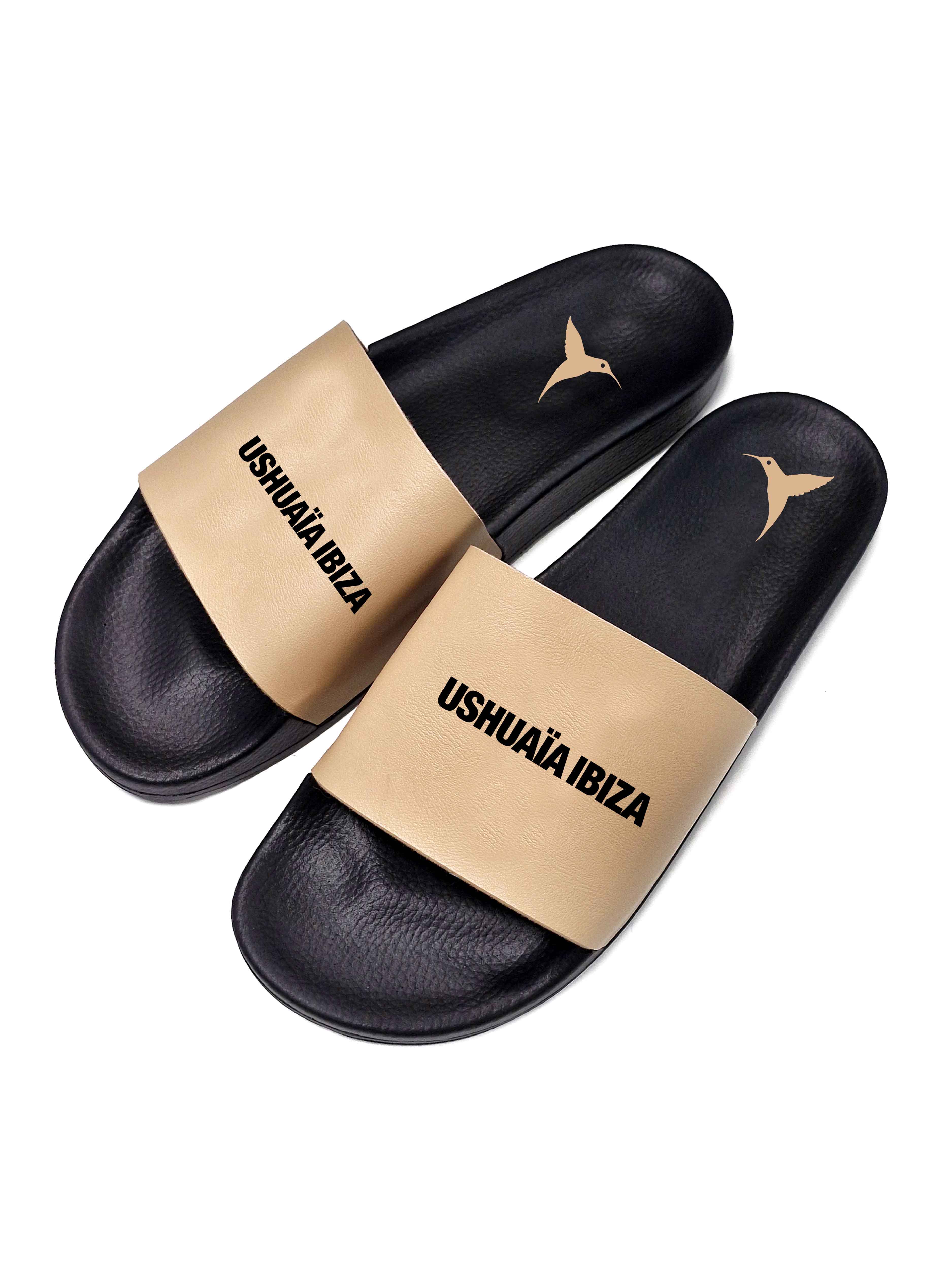 Beige flip flops with black logo.Polyurethane sole with cotton and polyester lining.Screen printing and engraving in high frecuency.