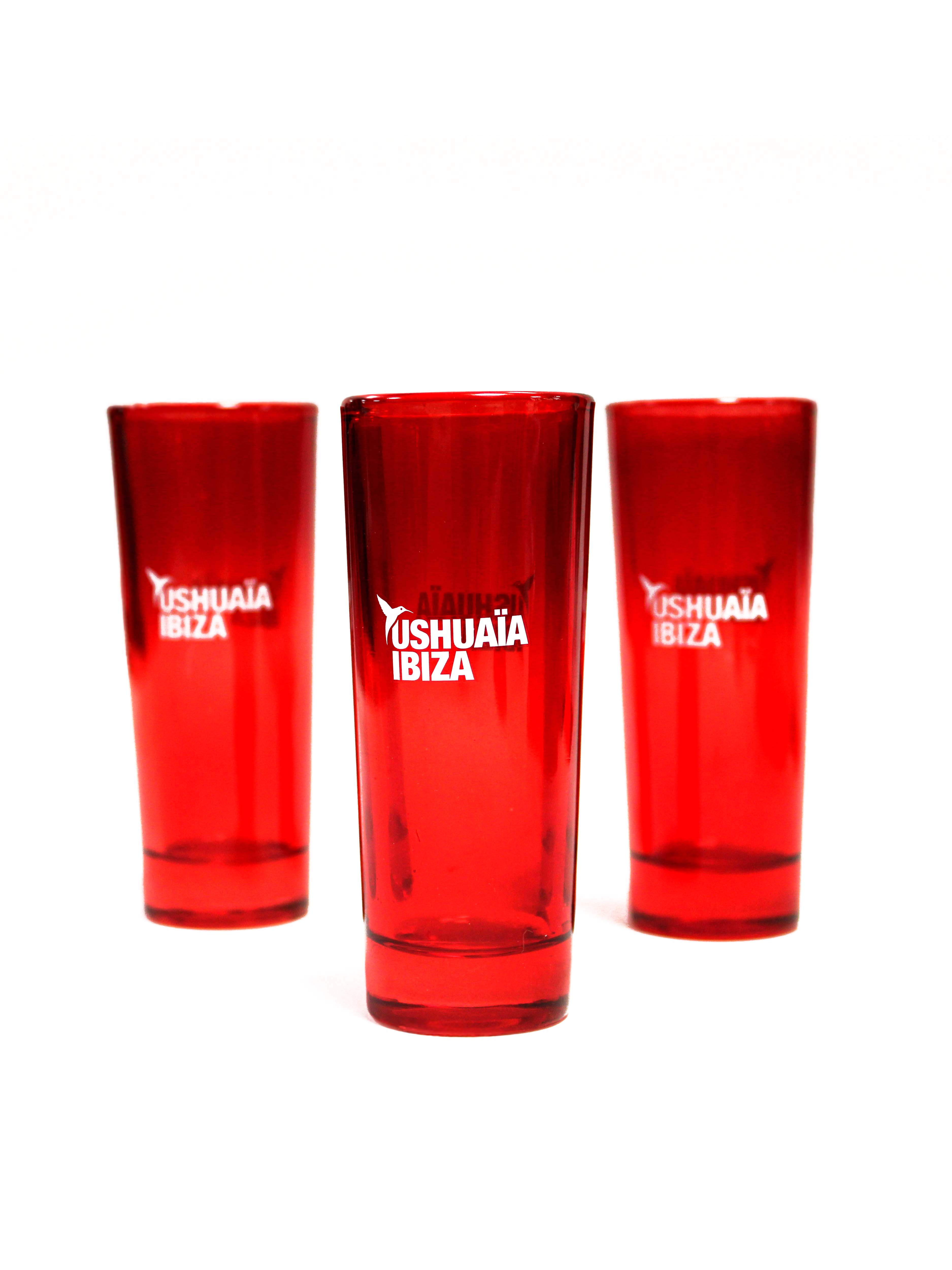 Red translucent shot glass with the official Ushuaïa Ibiza logo. Made of durable glass with a glossy finish. Capacity 50 ml, height 10 cm.