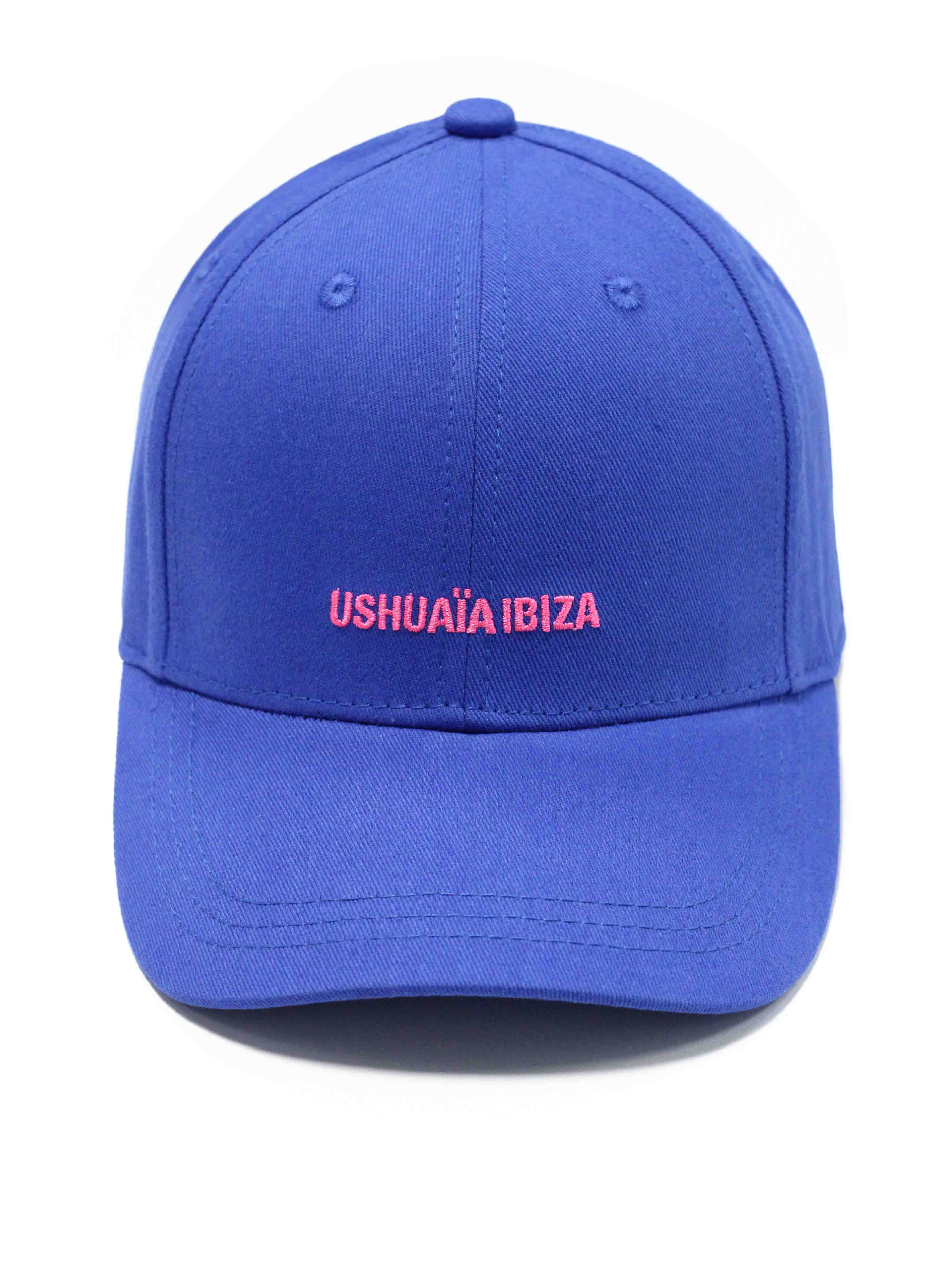 Curved visor cap in vibrant blue with contrasting pink Ushuaïa Ibiza rubber logo on the front. Adjustable back strap for a personalized fit.