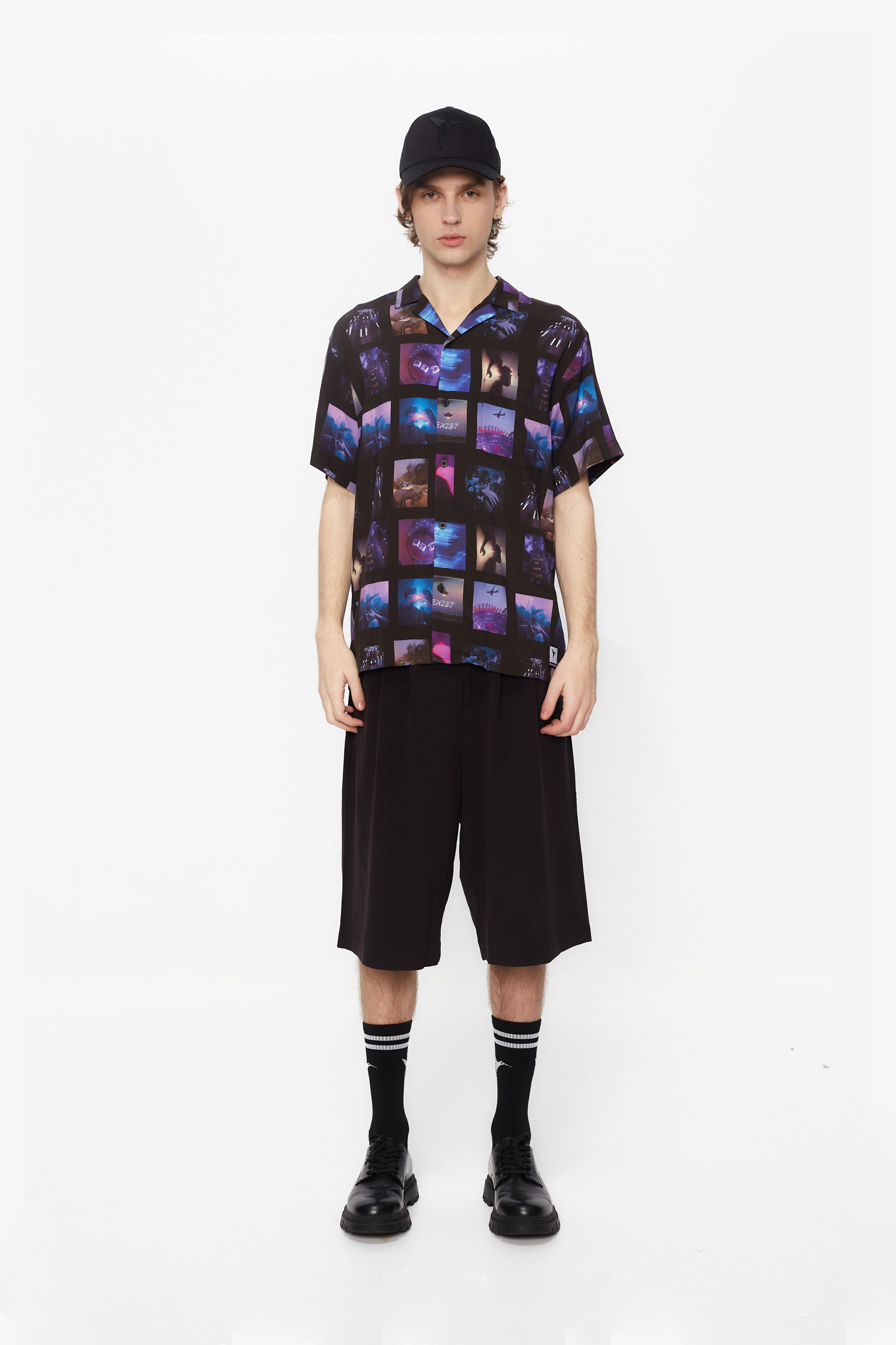 Printed shirt made of blend fabric. Lapel collar and short sleeve. Front button closure. Patch detail on the front and personalized label on the back.