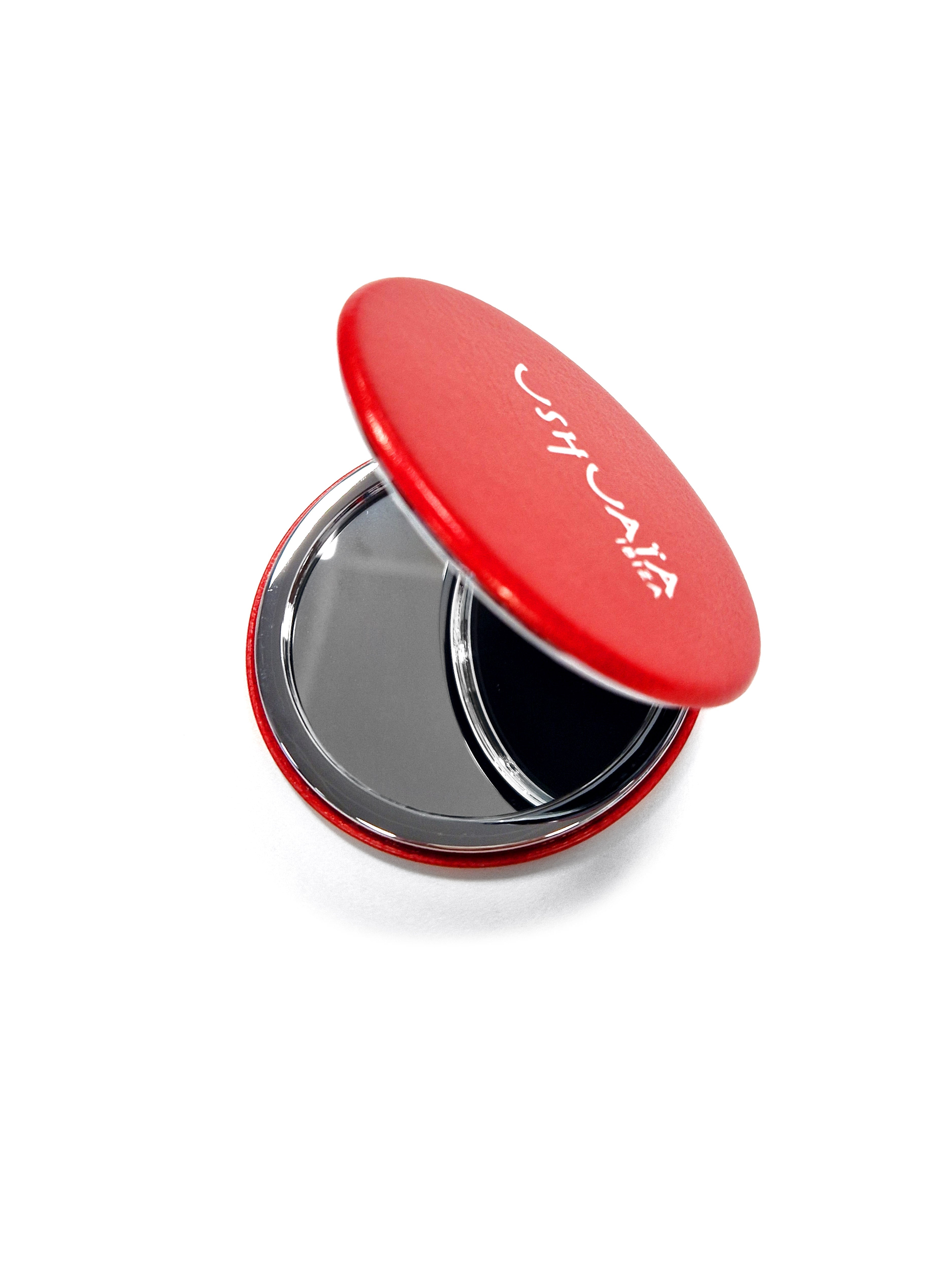 Red Ushuaïa Ibiza compact mirror with hummingbird graphic