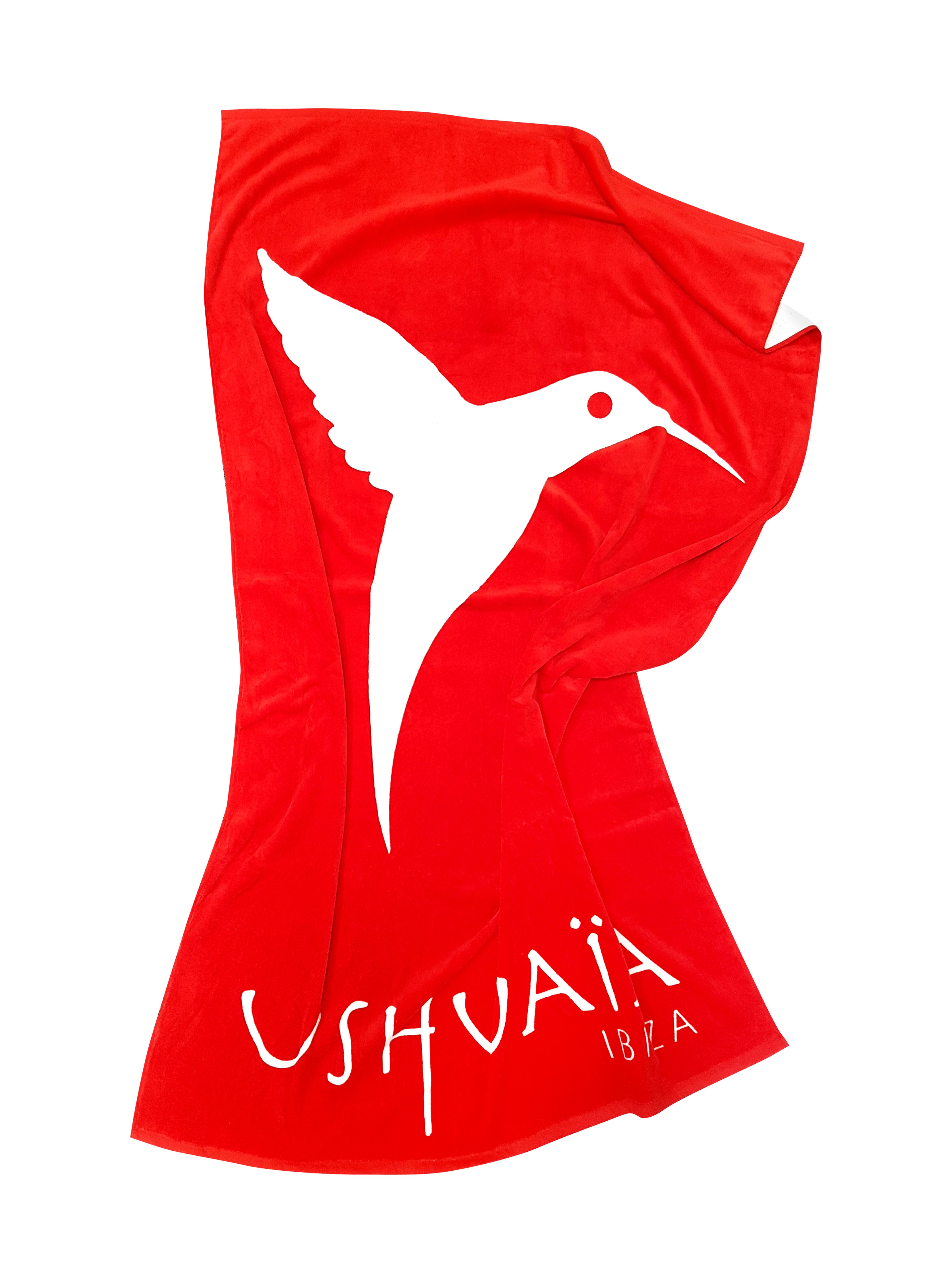 Toalla de color rojo con logo de Ushuaïa Ibiza en color blanco.