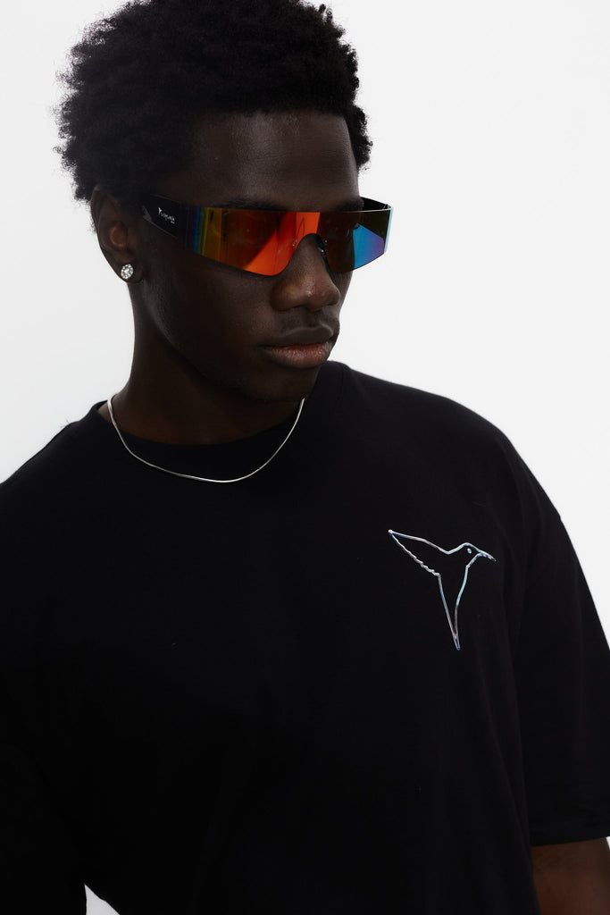 Oversized t-shirt with round neck and short sleeves. Contrast combined print detail on front and back.