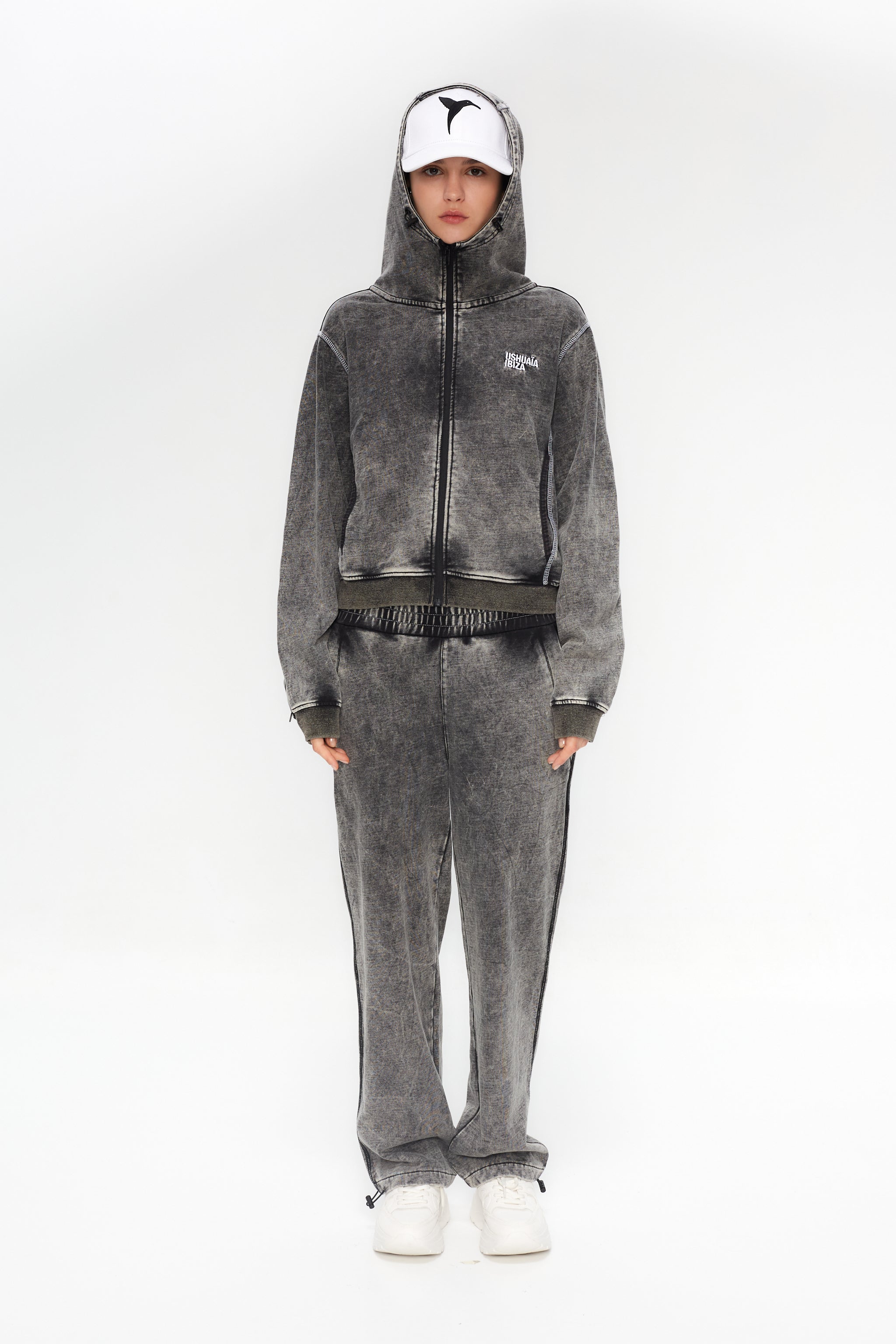 Wide-leg trousers with elastic waistband. Acid wash finish, contrast side print and reflective piping. Full-length design.
 