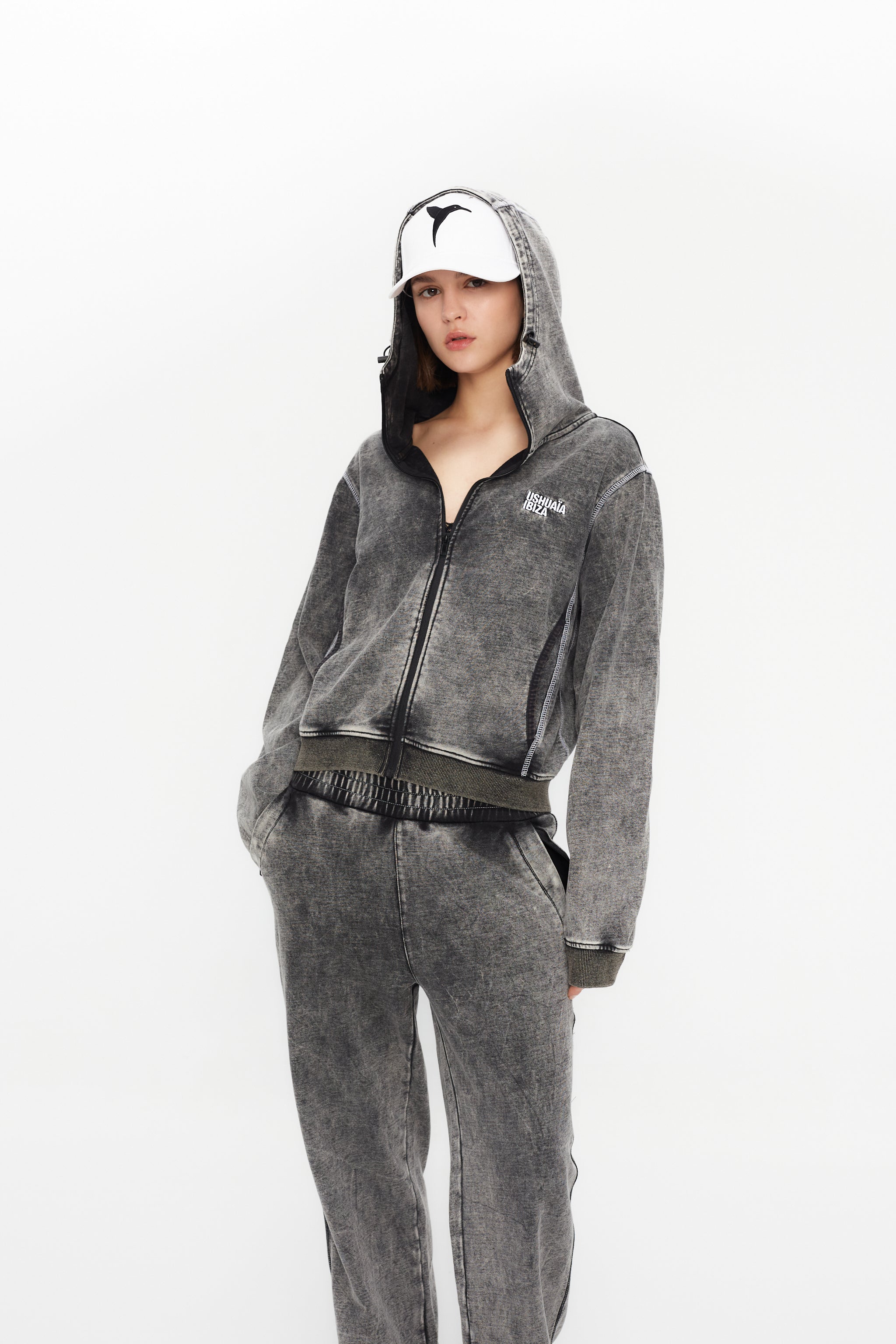 Wide-leg trousers with elastic waistband. Acid wash finish, contrast side print and reflective piping. Full-length design.
 